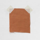 Burnt Orange Linen — mid-weight plain-weave linen with a slightly crisp handle that softens with wear, 100% linen, 135cm wide