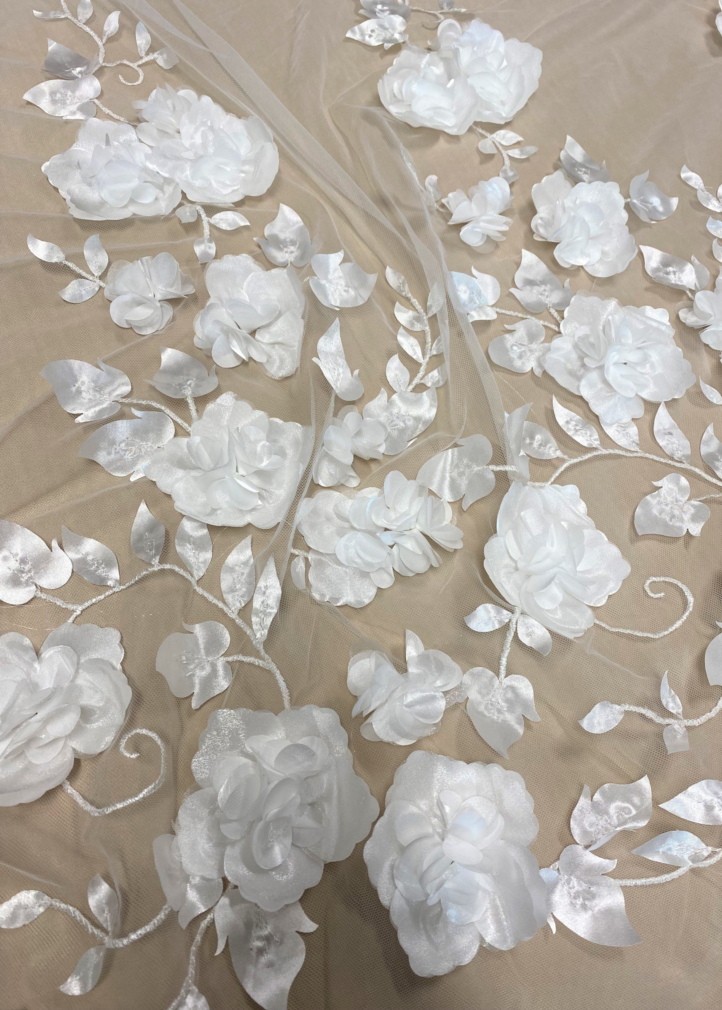 Ivory 3D Floral Tulle — featuring floral motifs, a 3D floral design and a border design, 40% polyester 30% nylon 30% rayon, 130cm wide