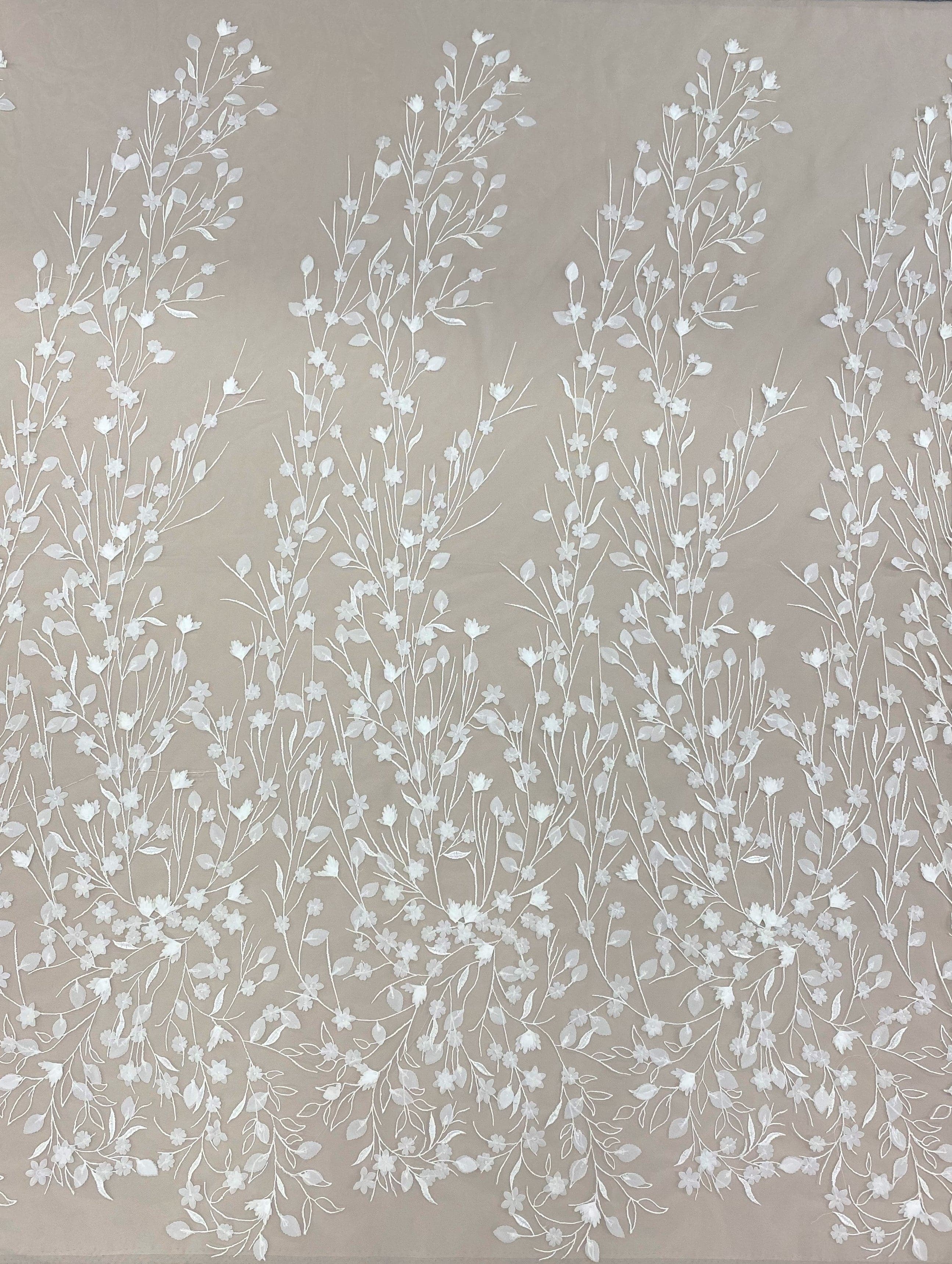 Ivory Embellished Tulle — featuring floral motifs and a botanical design, 30% nylon 40% polyester 30% rayon, 130cm wide