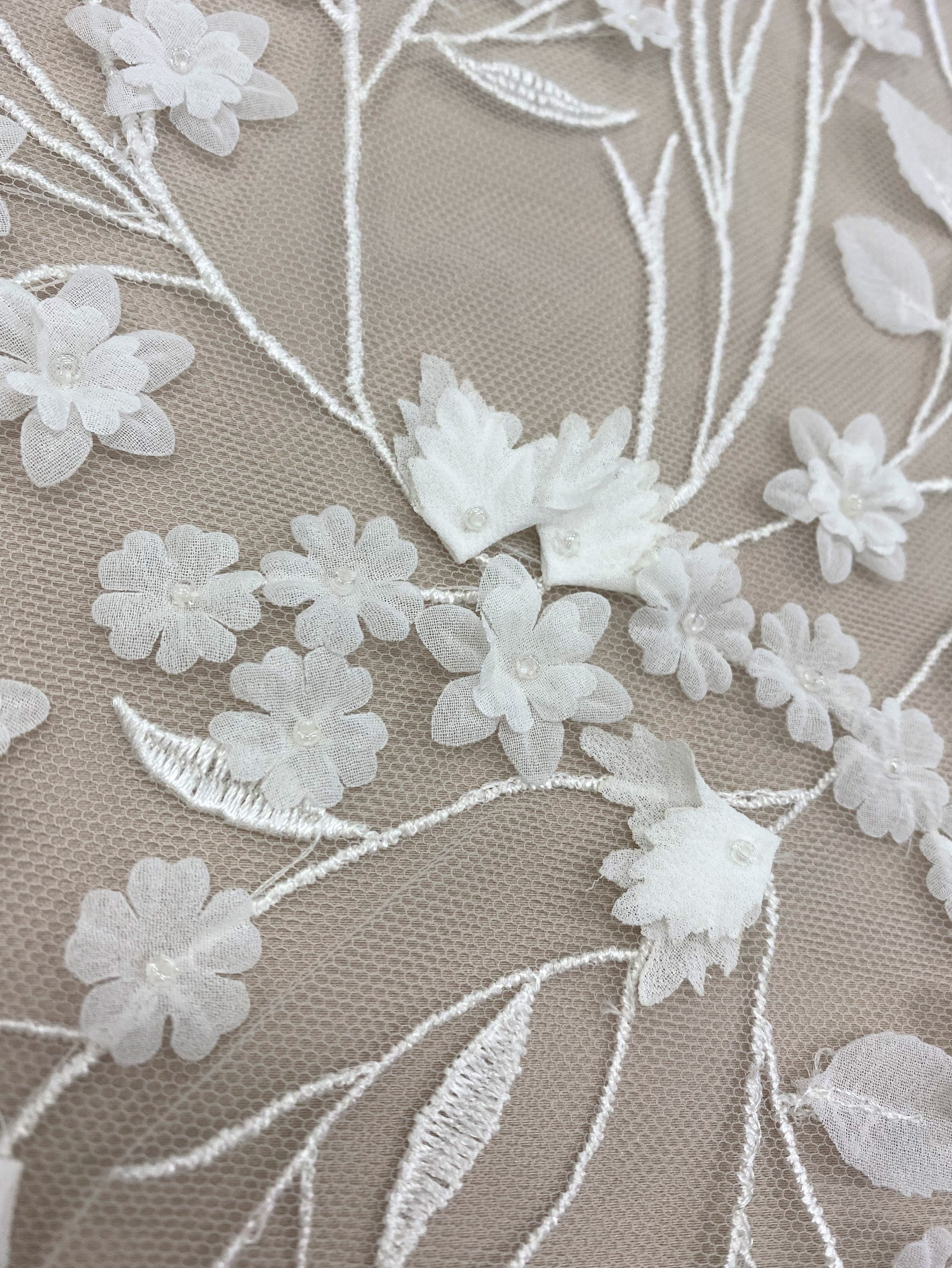 Ivory Embellished Tulle — featuring floral motifs and a botanical design, 30% nylon 40% polyester 30% rayon, 130cm wide