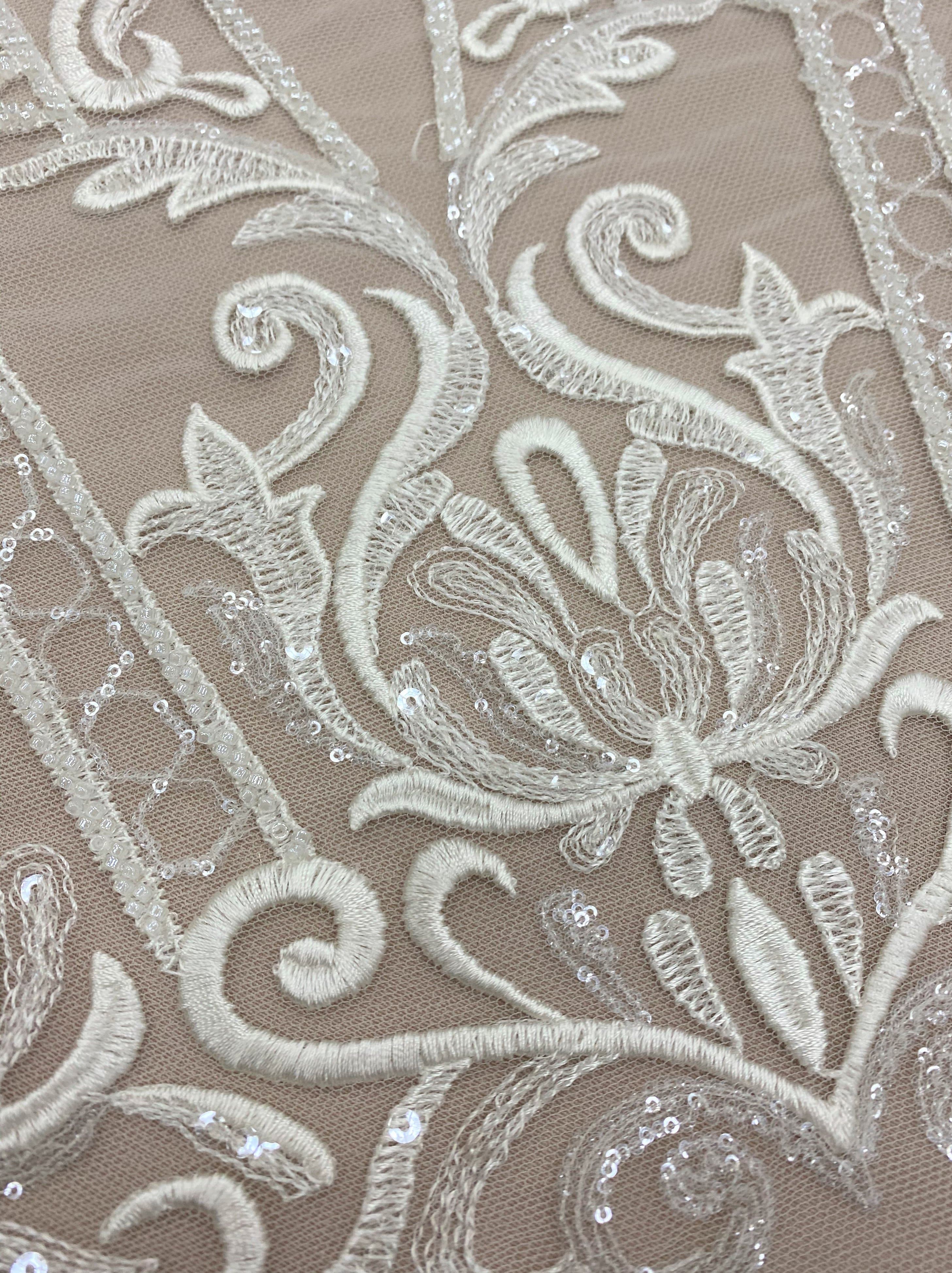 Ivory Embroidered Tulle — featuring scalloped edges and sequins, 30% nylon 30% rayon 40% polyester, 130cm wide