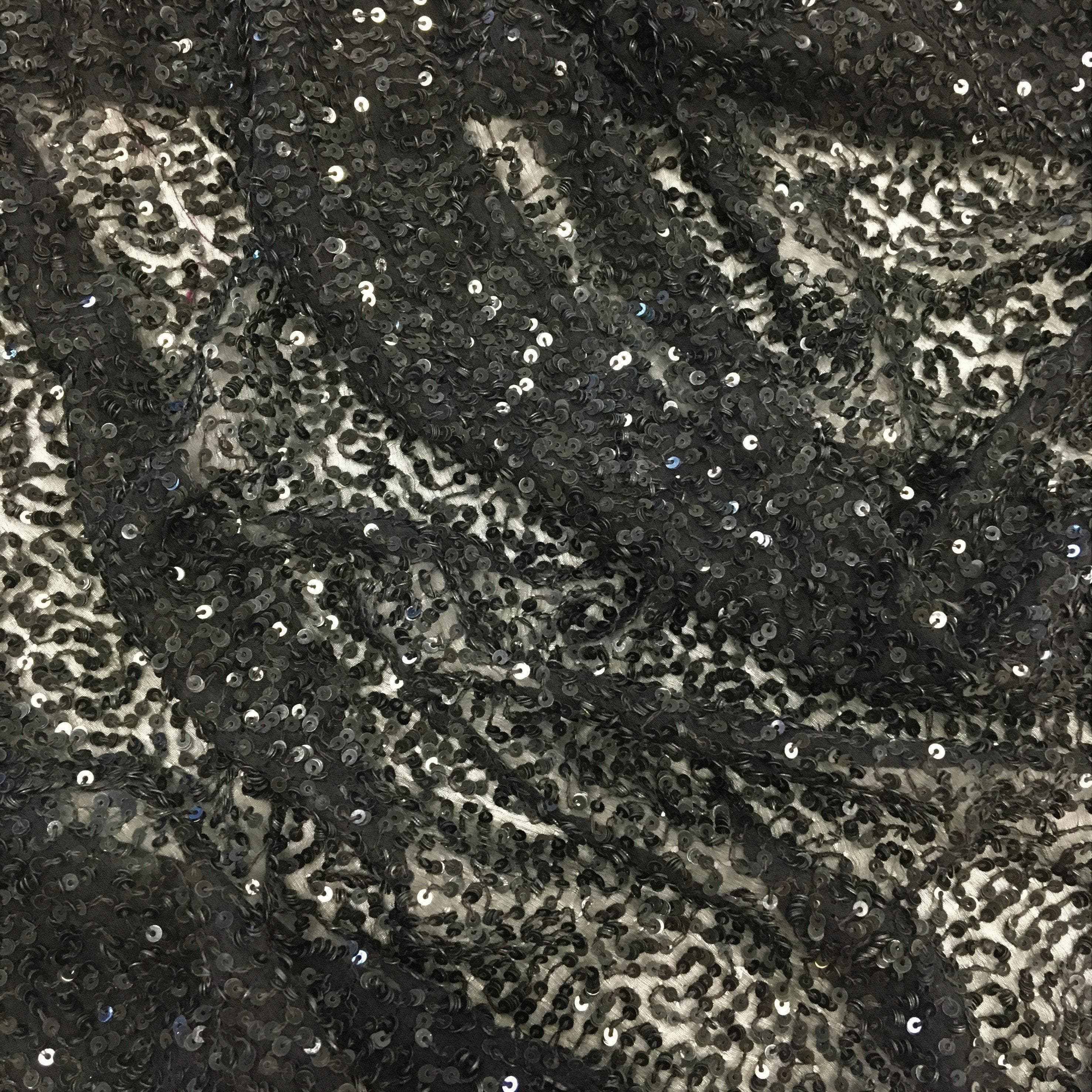 Black Sequin Georgette — heavily sequined on a 100% silk georgette base, with sequins running the length, 110cm wide
