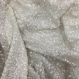 Platinum Sequin Georgette — heavily sequined on a 100% silk georgette base, with sequins running the length, 110cm wide