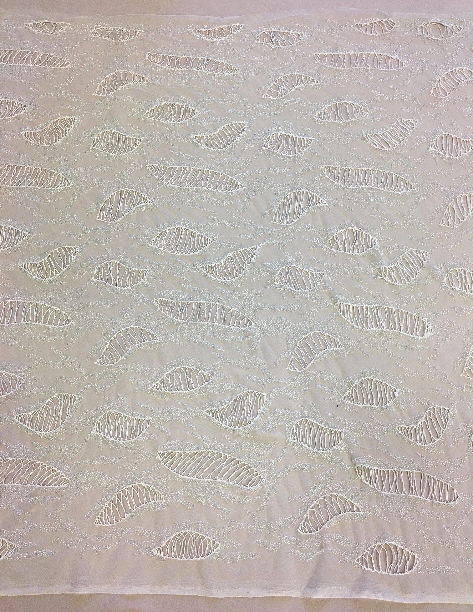 Ivory Hand Beaded Tulle — featuring a corded texture and hand-beading, 100% nylon, 110cm wide