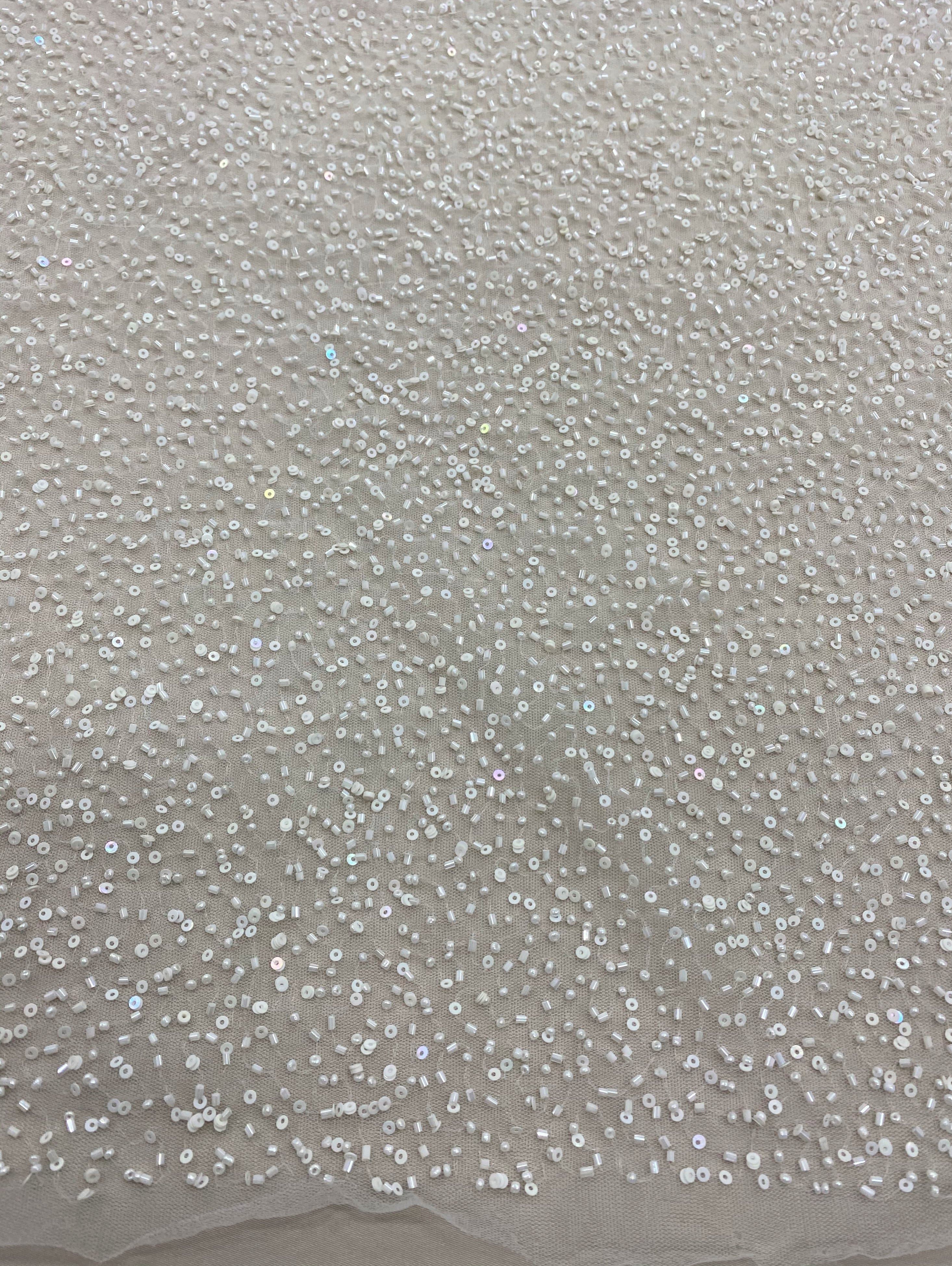 Ivory Beaded Tulle — featuring hand-beading and sequins, 100% nylon, 110cm wide