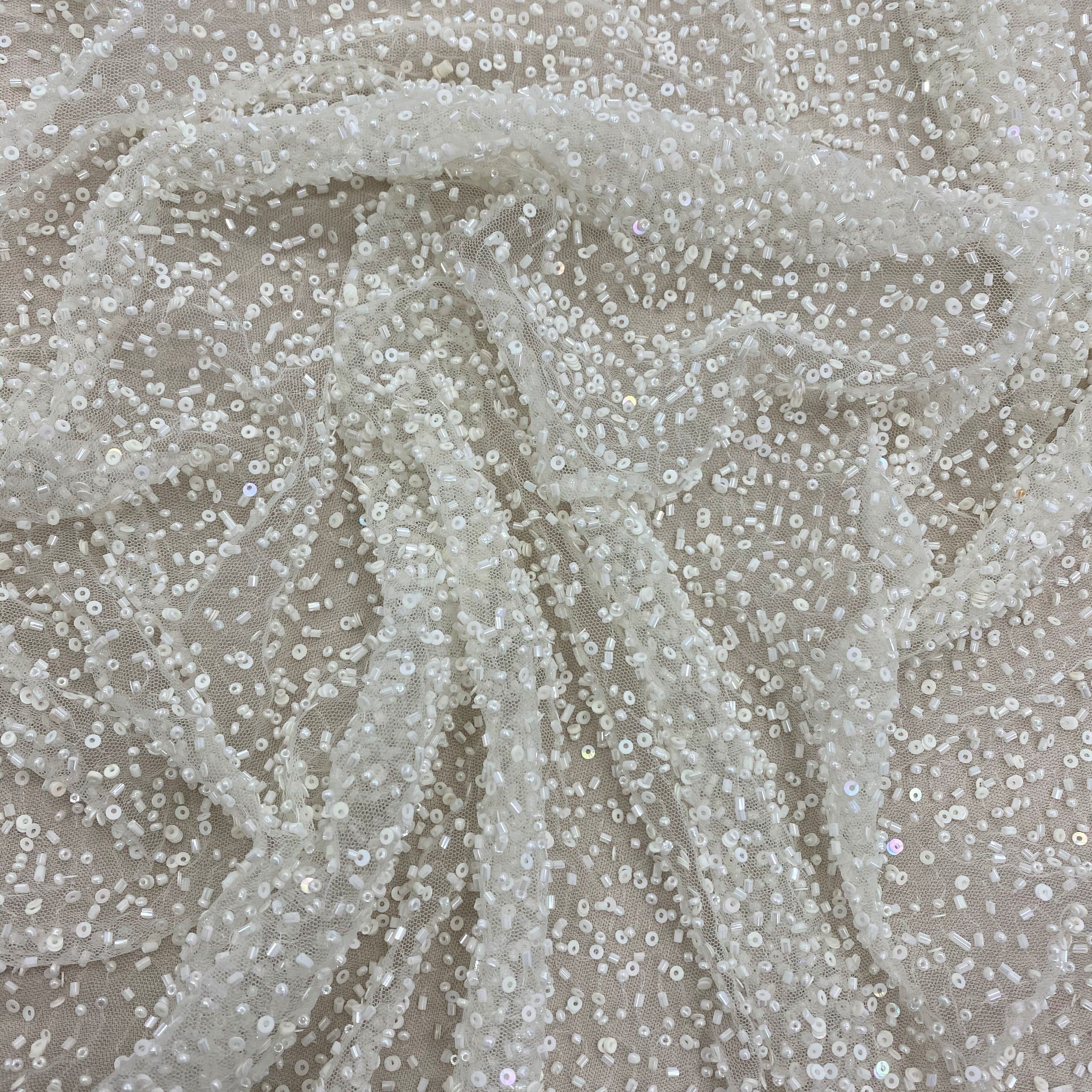 Ivory Beaded Tulle — featuring hand-beading and sequins, 100% nylon, 110cm wide