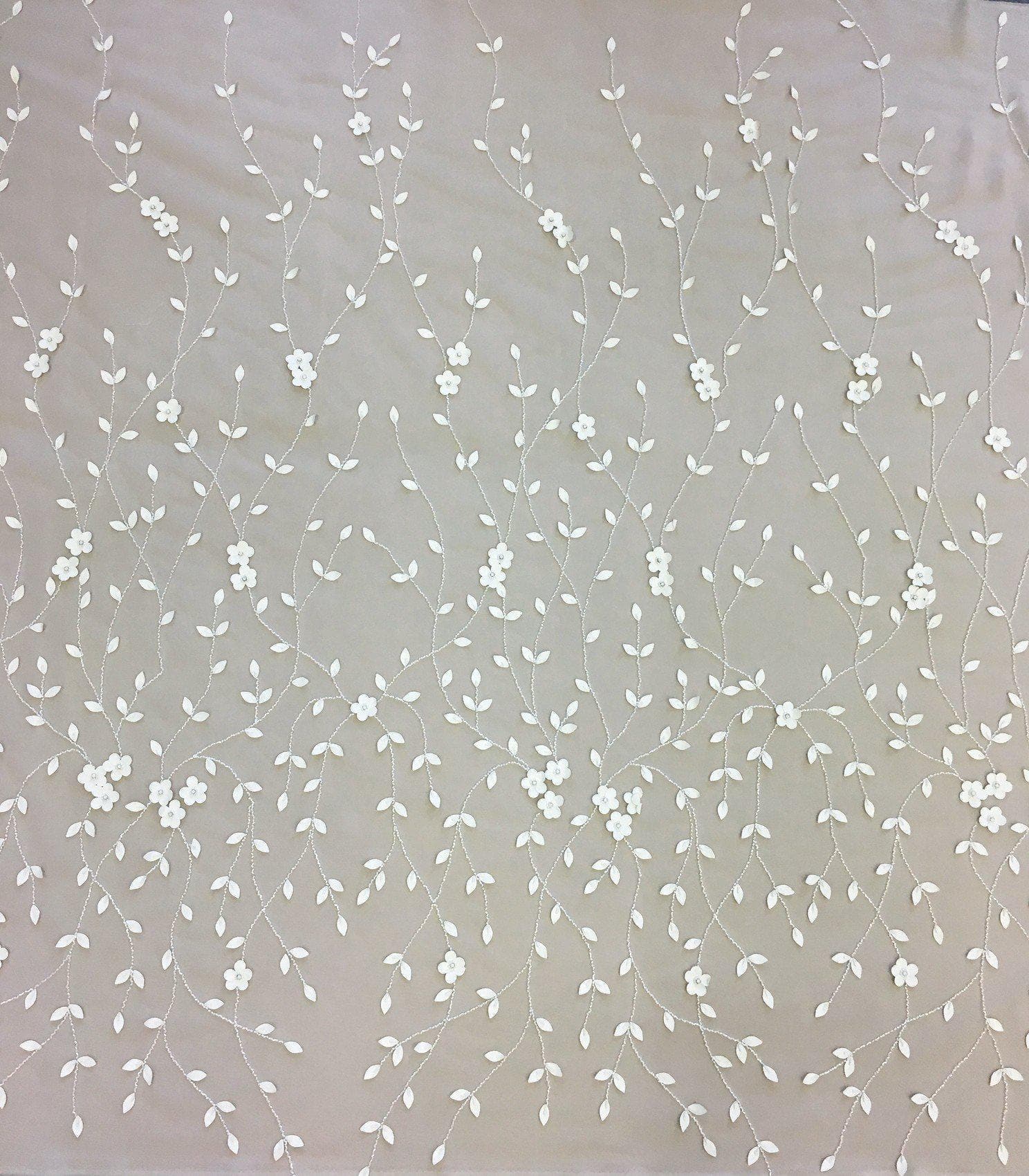 Ivory Leather Floral Embellished Tulle — featuring floral motifs and hand-beading, 100% nylon, 140cm wide