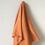Burnt Orange Linen — mid-weight plain-weave linen with a slightly crisp handle that softens with wear, 100% linen, 135cm wide
