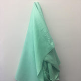 Mint Linen — mid-weight plain-weave linen with a slightly crisp handle that softens with wear, 100% linen, 135cm wide