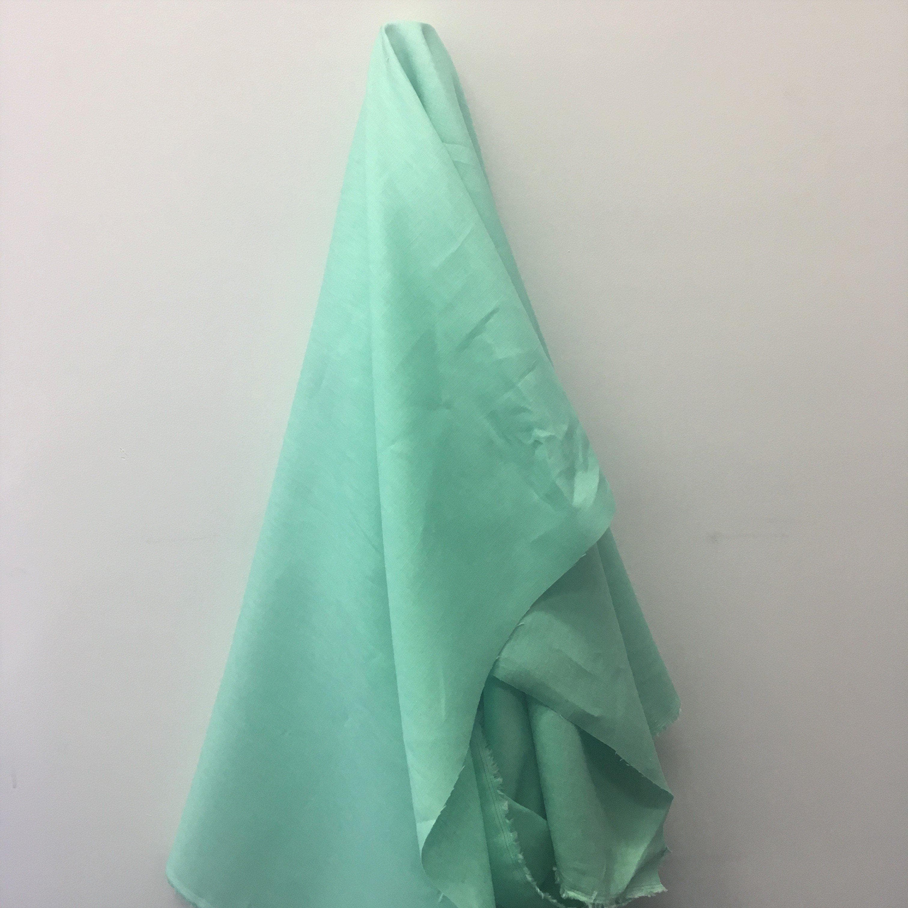 Mint Linen — mid-weight plain-weave linen with a slightly crisp handle that softens with wear, 100% linen, 135cm wide