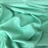 Mint Linen — mid-weight plain-weave linen with a slightly crisp handle that softens with wear, 100% linen, 135cm wide