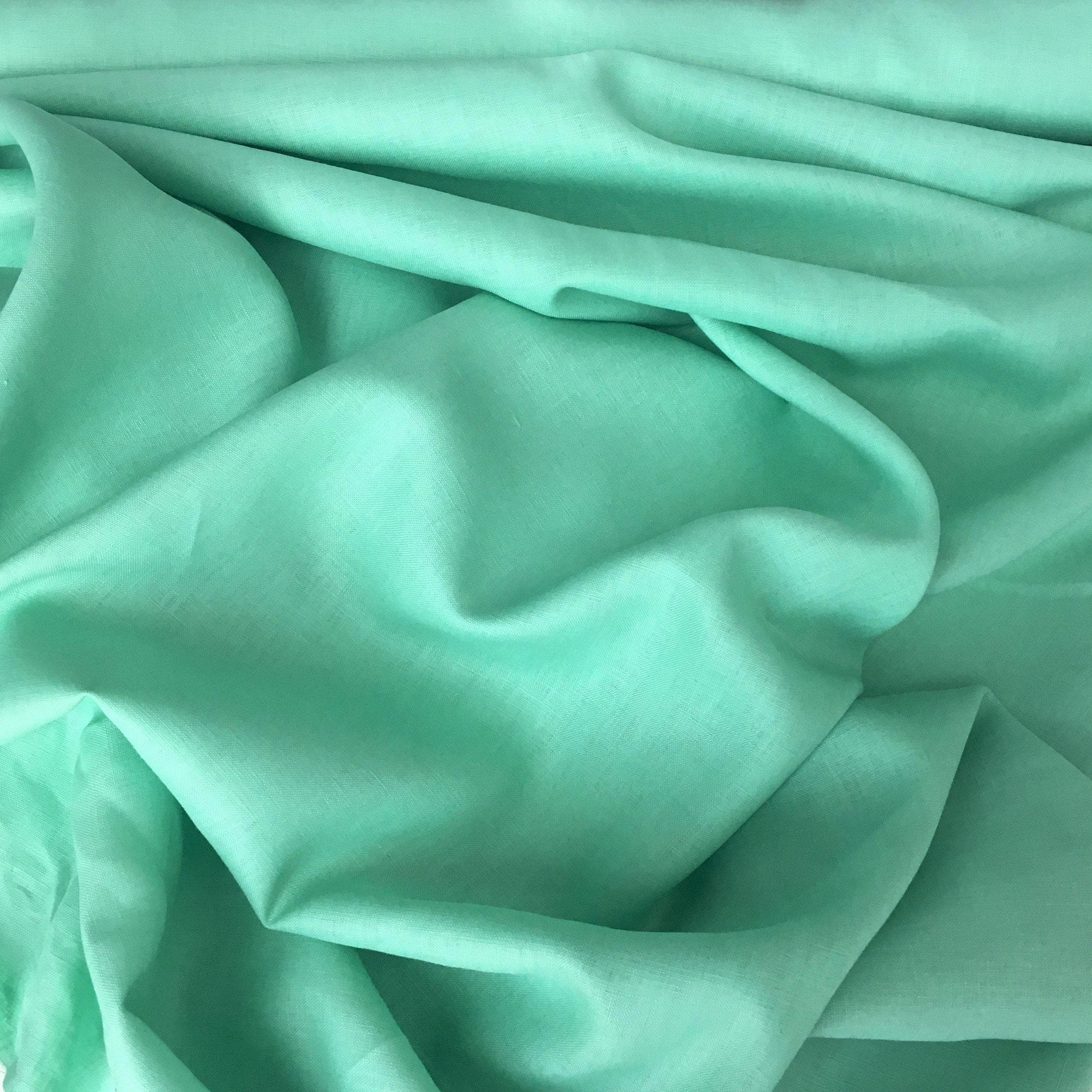 Mint Linen — mid-weight plain-weave linen with a slightly crisp handle that softens with wear, 100% linen, 135cm wide