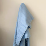 Sky Blue Linen — mid-weight plain-weave linen with a slightly crisp handle that softens with wear, 100% linen, 135cm wide