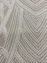Ivory Heavily Embellished Tulle — featuring scalloped edges and hand-beading, 50% nylon 50% rayon, 130cm wide
