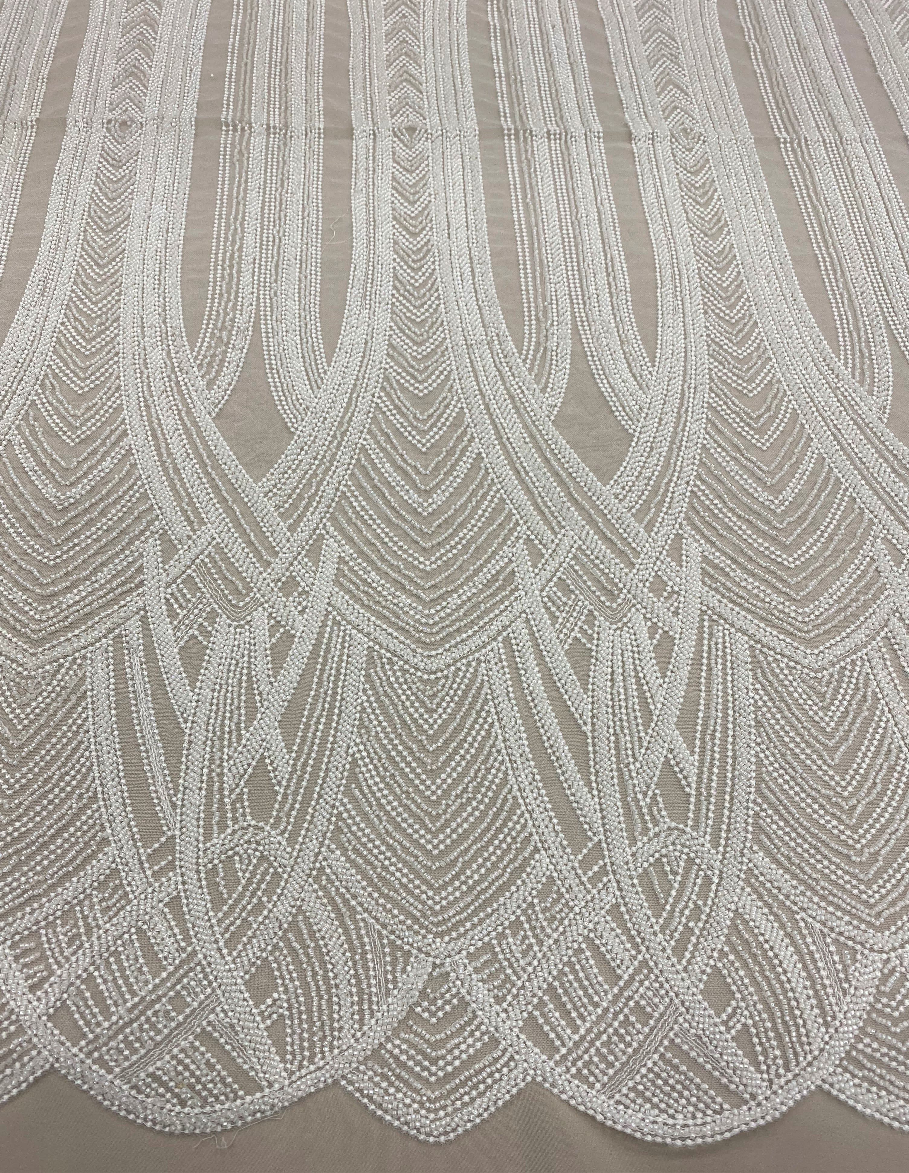 Ivory Heavily Embellished Tulle — featuring scalloped edges and hand-beading, 50% nylon 50% rayon, 130cm wide