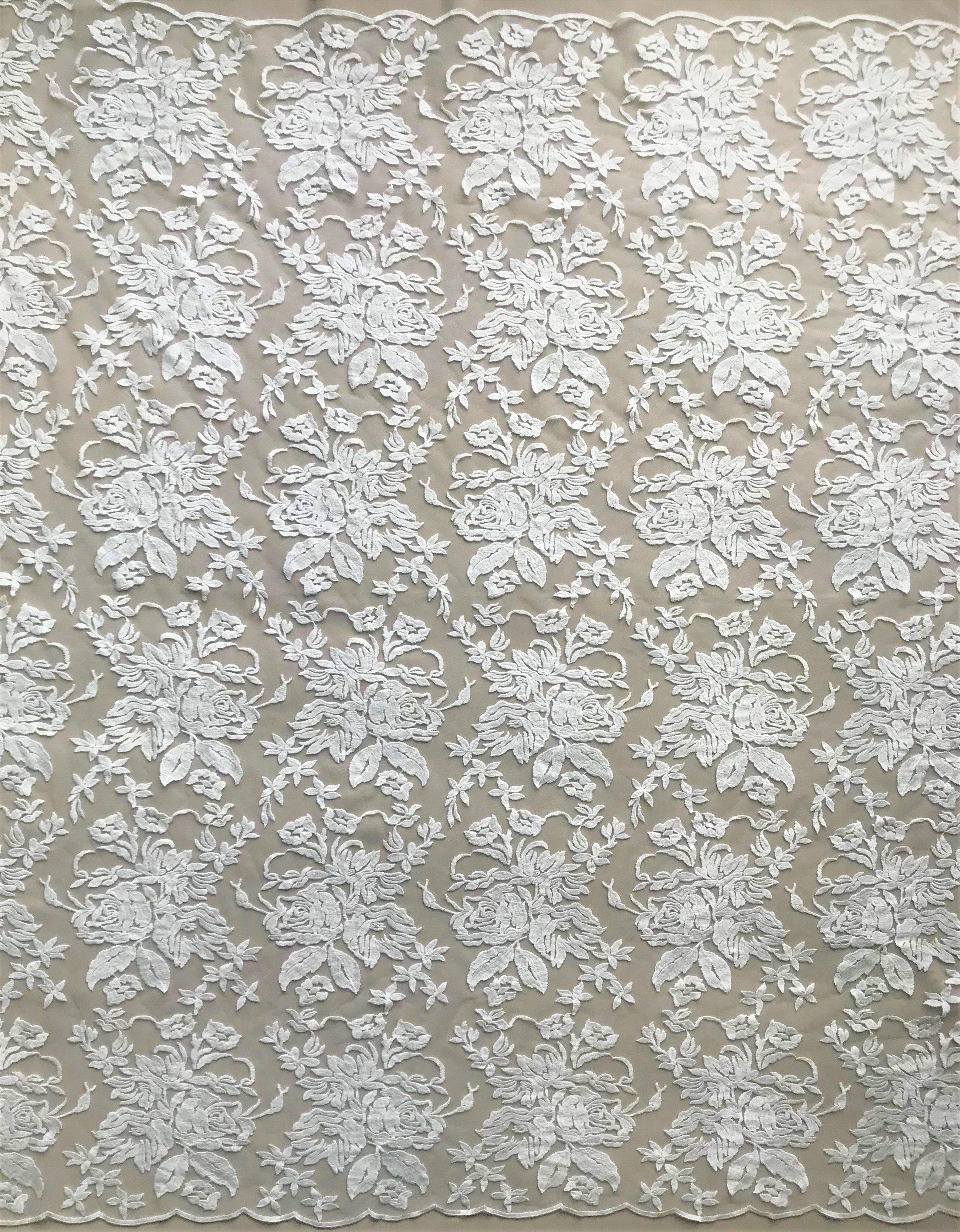 Ivory Floral Embroidered Tulle — featuring scalloped edges and floral motifs, 50% nylon 50% rayon, 130cm wide