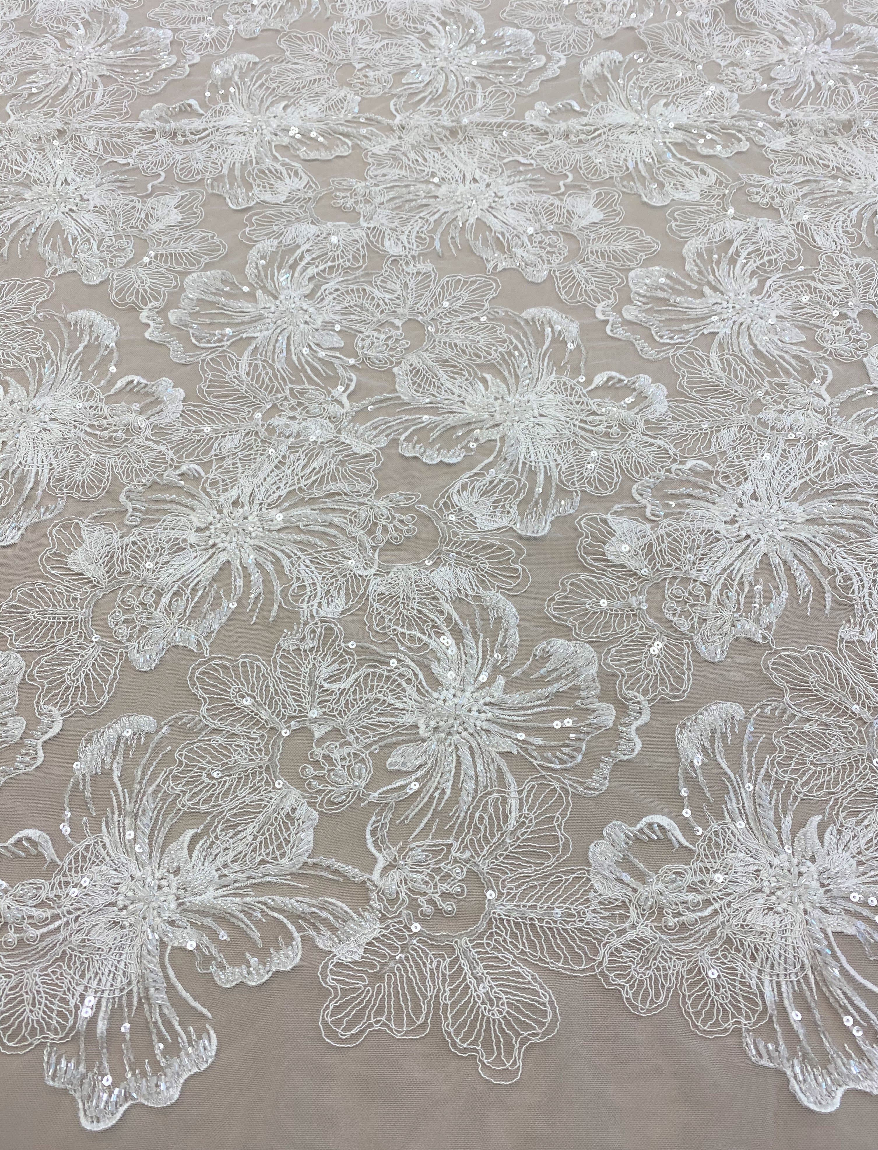 Ivory Embroidered Corded Tulle — featuring floral motifs, a corded texture and hand-beading, 50% nylon 50% rayon, 130cm wide