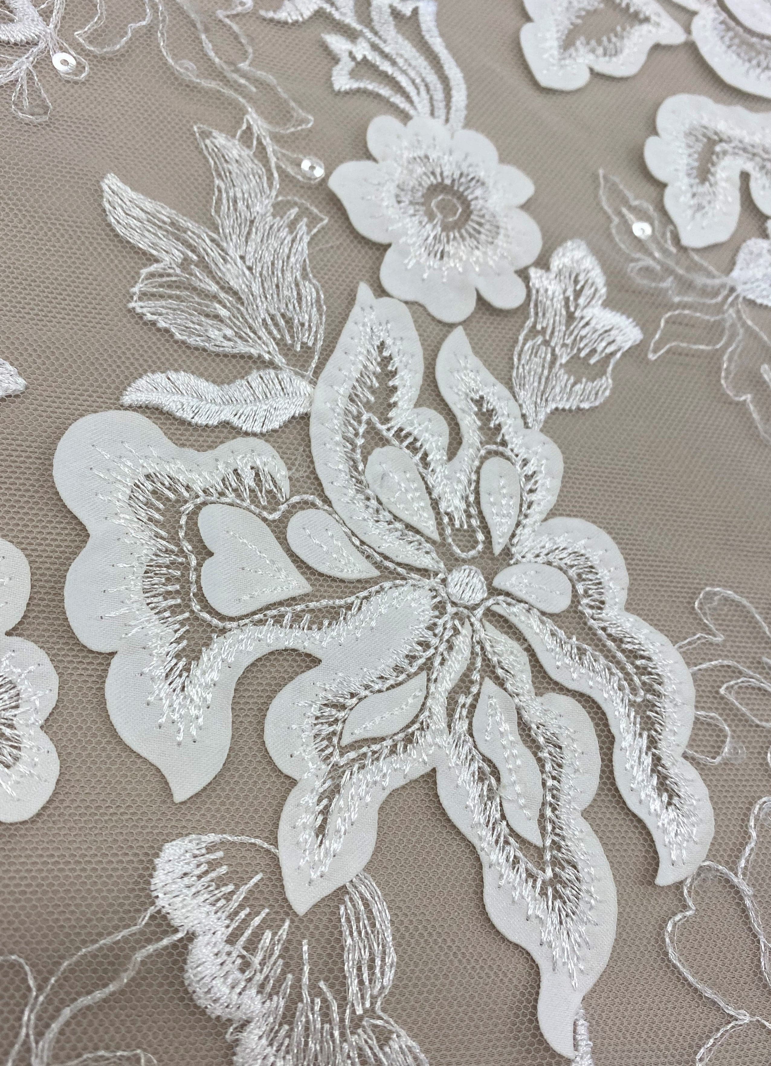 Ivory Embellished Tulle — featuring floral motifs, a border design and sequins, 30% nylon 60% rayon 10% polyester, 130cm wide