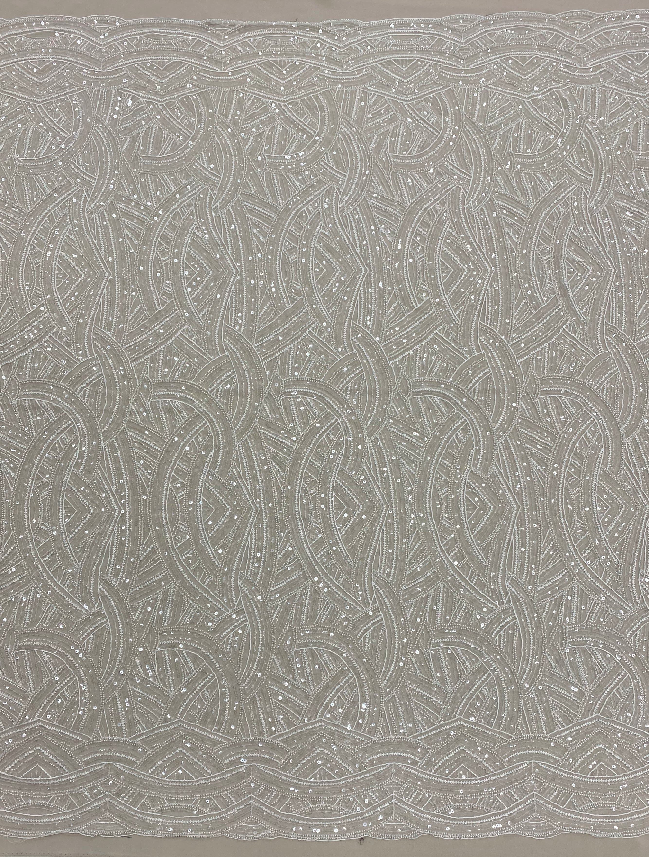Ivory Embellished Tulle — featuring scalloped edges, hand-beading and sequins, 50% rayon 50% nylon, 130cm wide