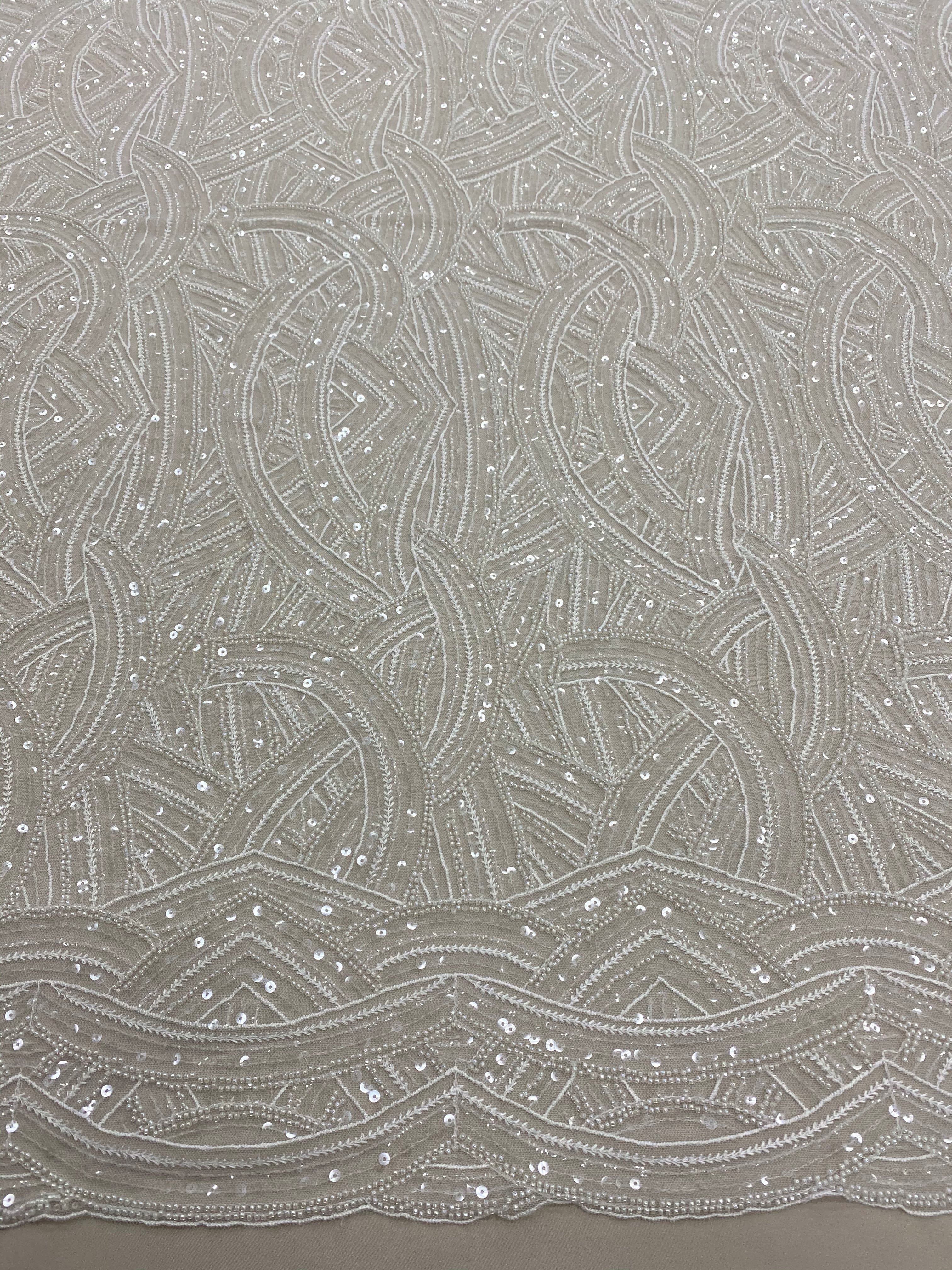 Ivory Embellished Tulle — featuring scalloped edges, hand-beading and sequins, 50% rayon 50% nylon, 130cm wide