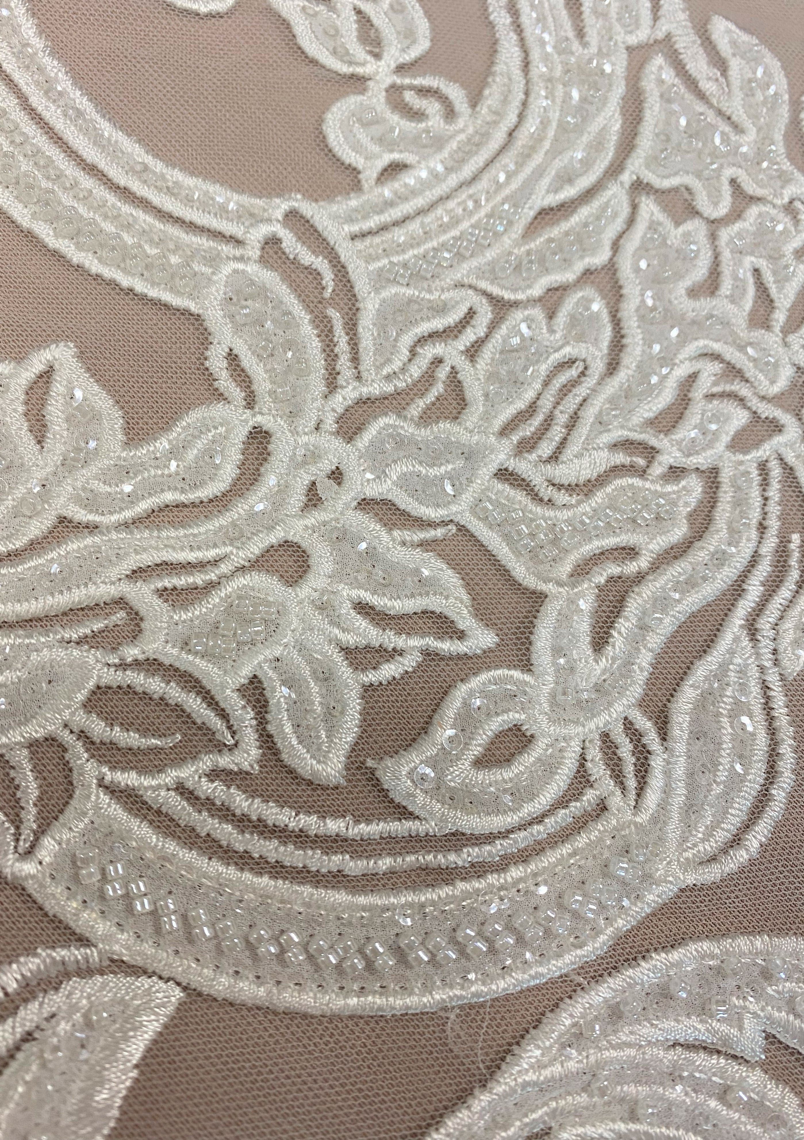 Ivory Embroidered Tulle — featuring floral motifs, hand-beading and sequins, 50% nylon 50% rayon, 130cm wide
