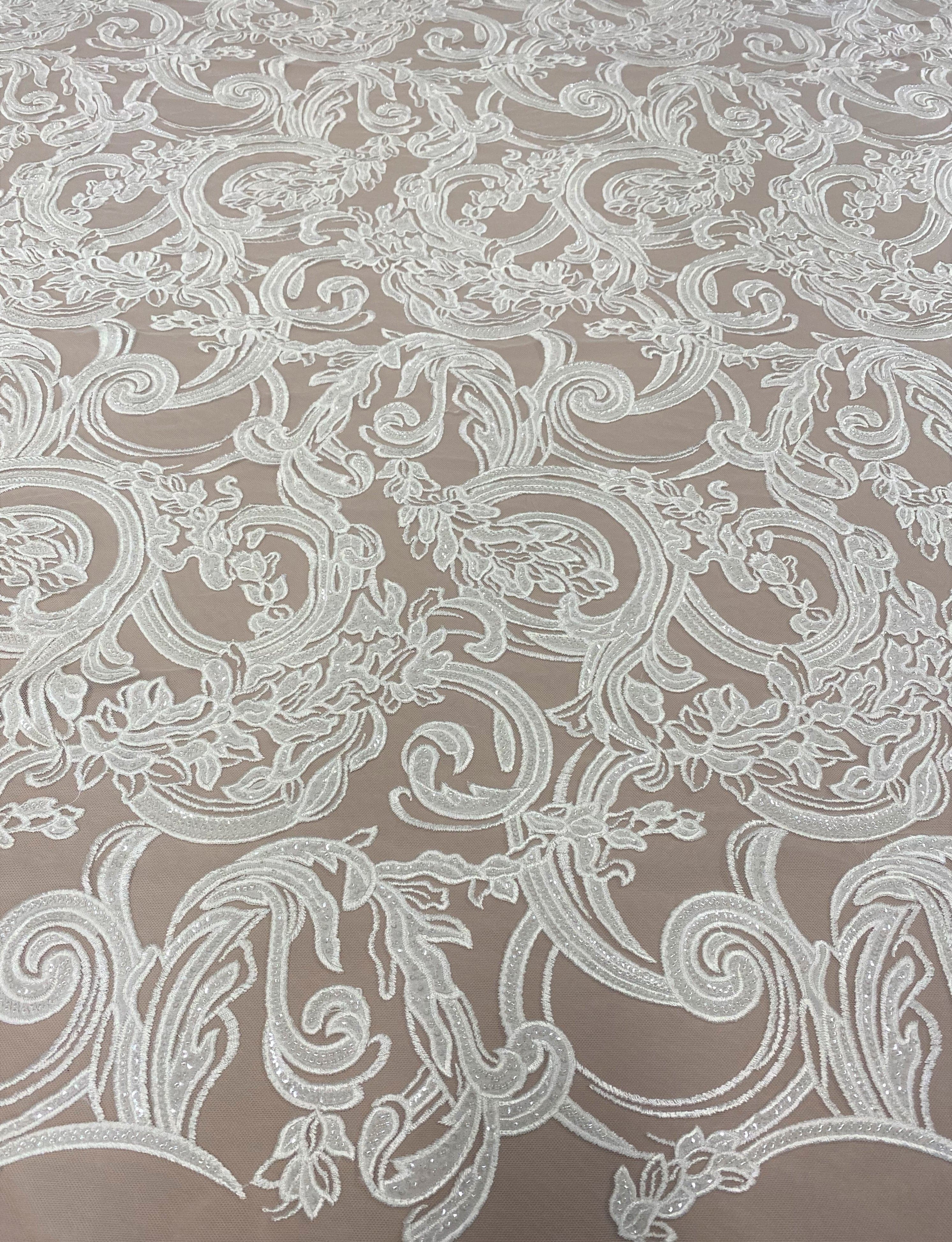 Ivory Embroidered Tulle — featuring floral motifs, hand-beading and sequins, 50% nylon 50% rayon, 130cm wide