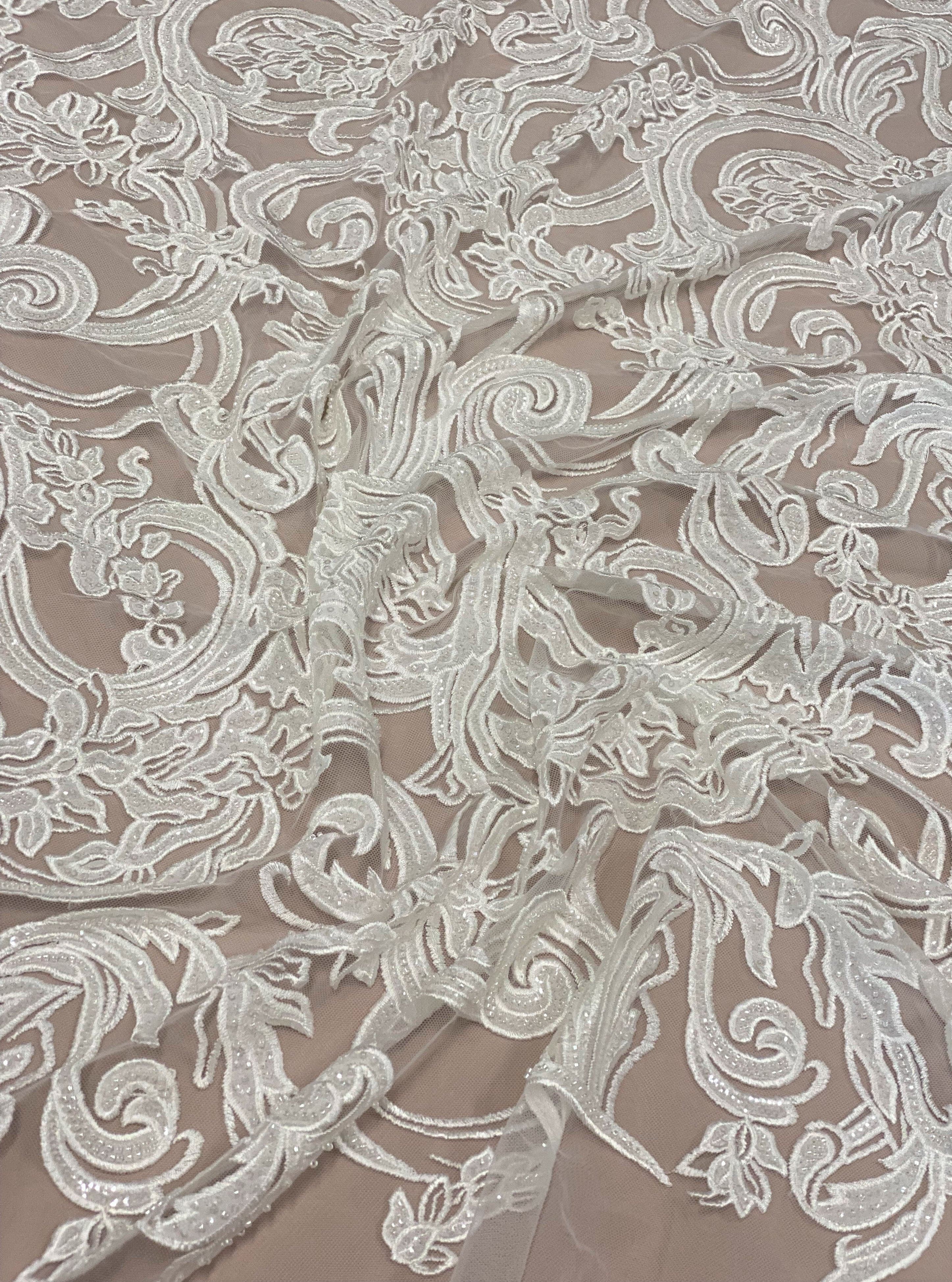 Ivory Embroidered Tulle — featuring floral motifs, hand-beading and sequins, 50% nylon 50% rayon, 130cm wide