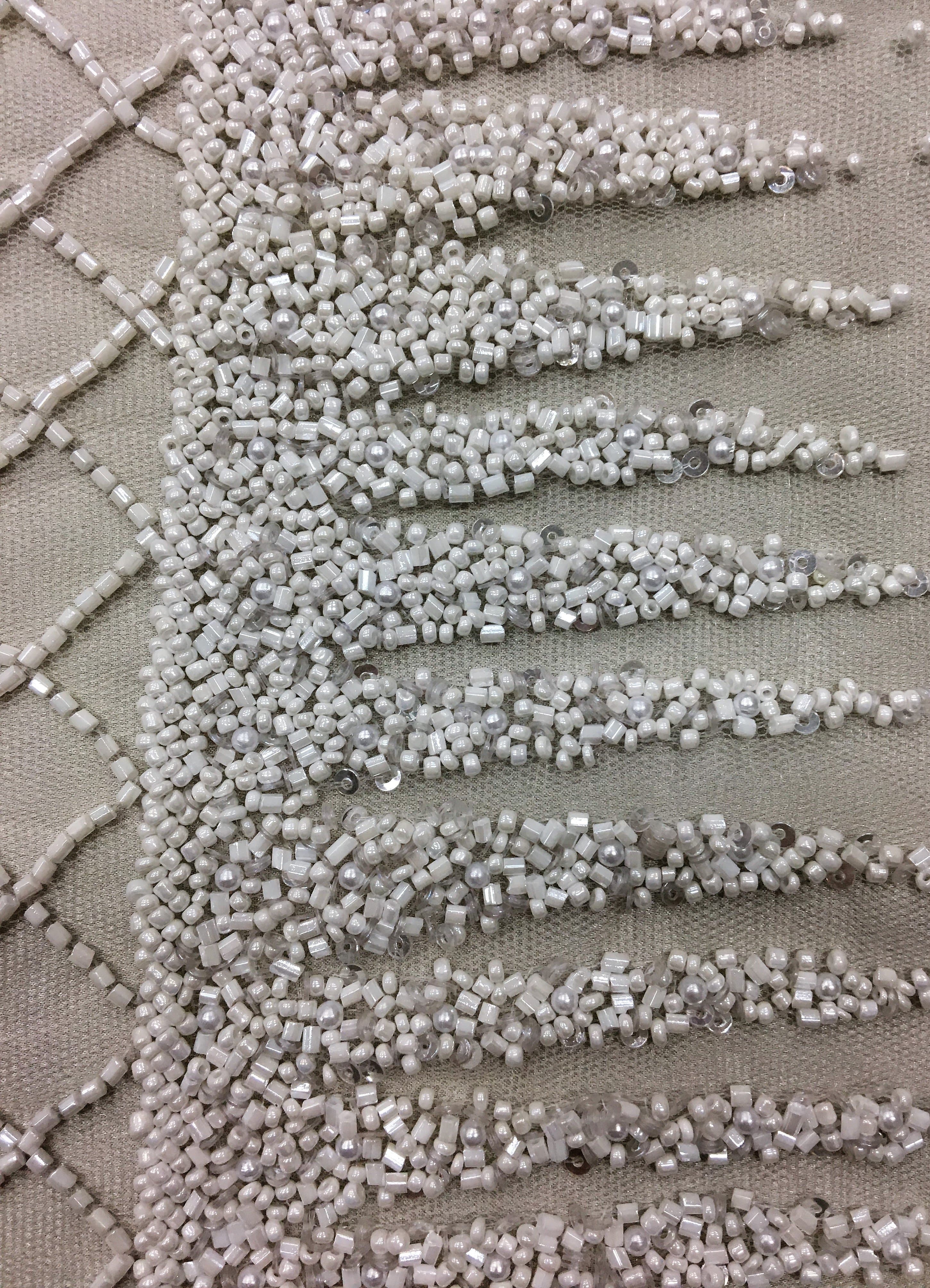 Ivory Ornamental Hand Beaded Tulle — featuring hand-beading and sequins, 100% nylon, 125cm wide