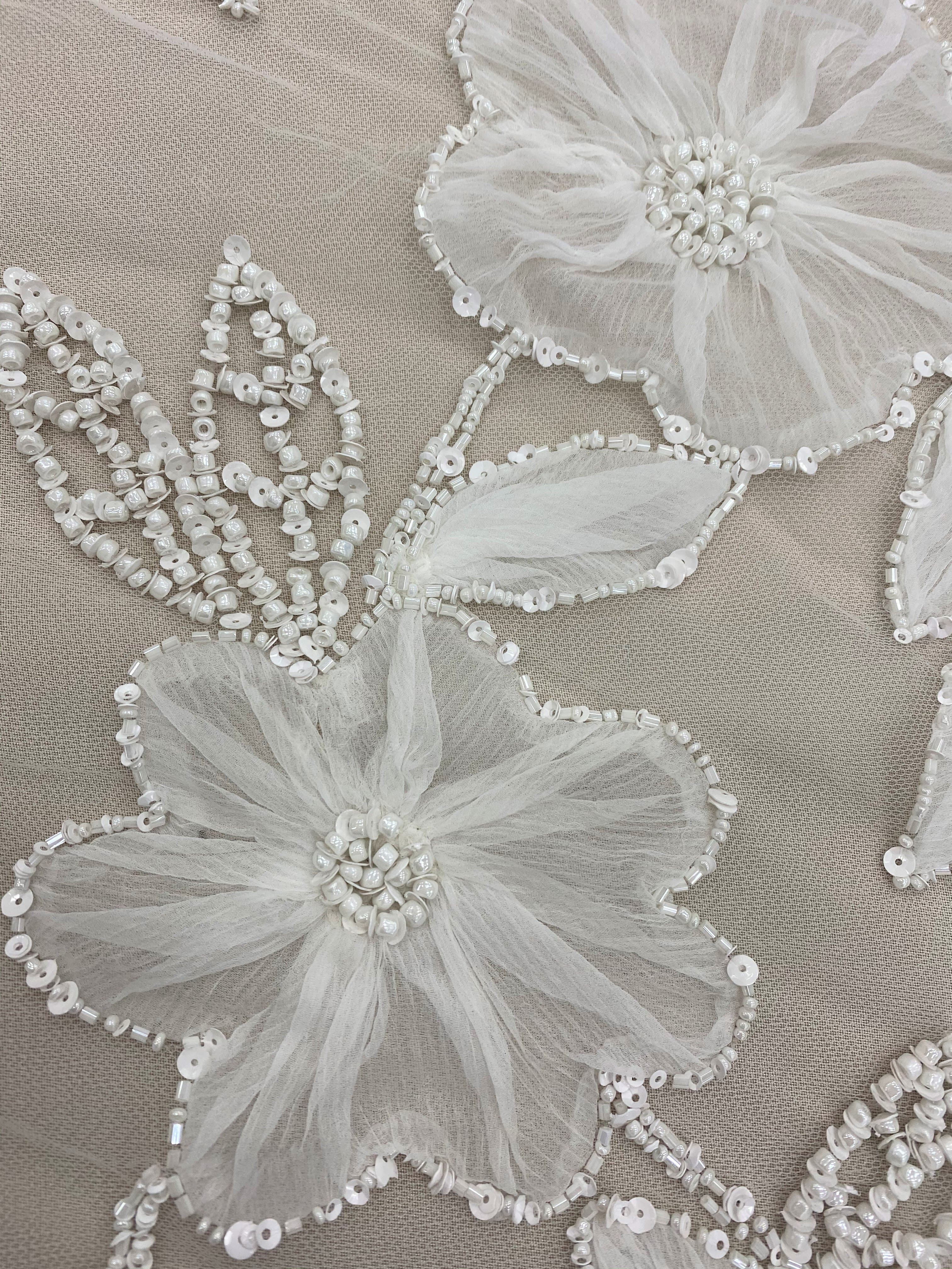 Ivory Embellished Tulle — featuring floral motifs, hand-beading and sequins, 100% nylon, 125cm wide