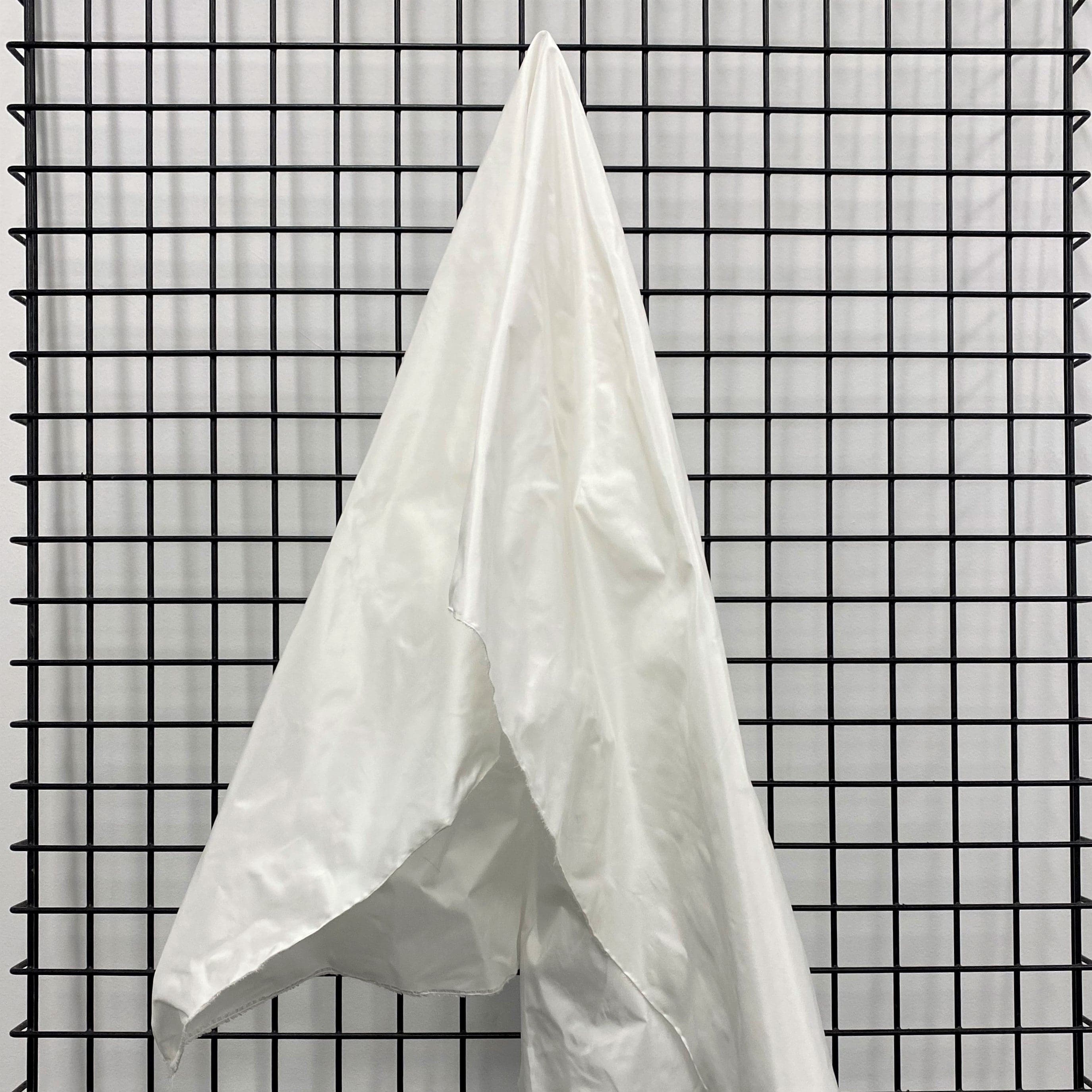 Ivory Taffeta — a mid-weight silk taffeta with a smooth texture and crisp handle, 100% silk
