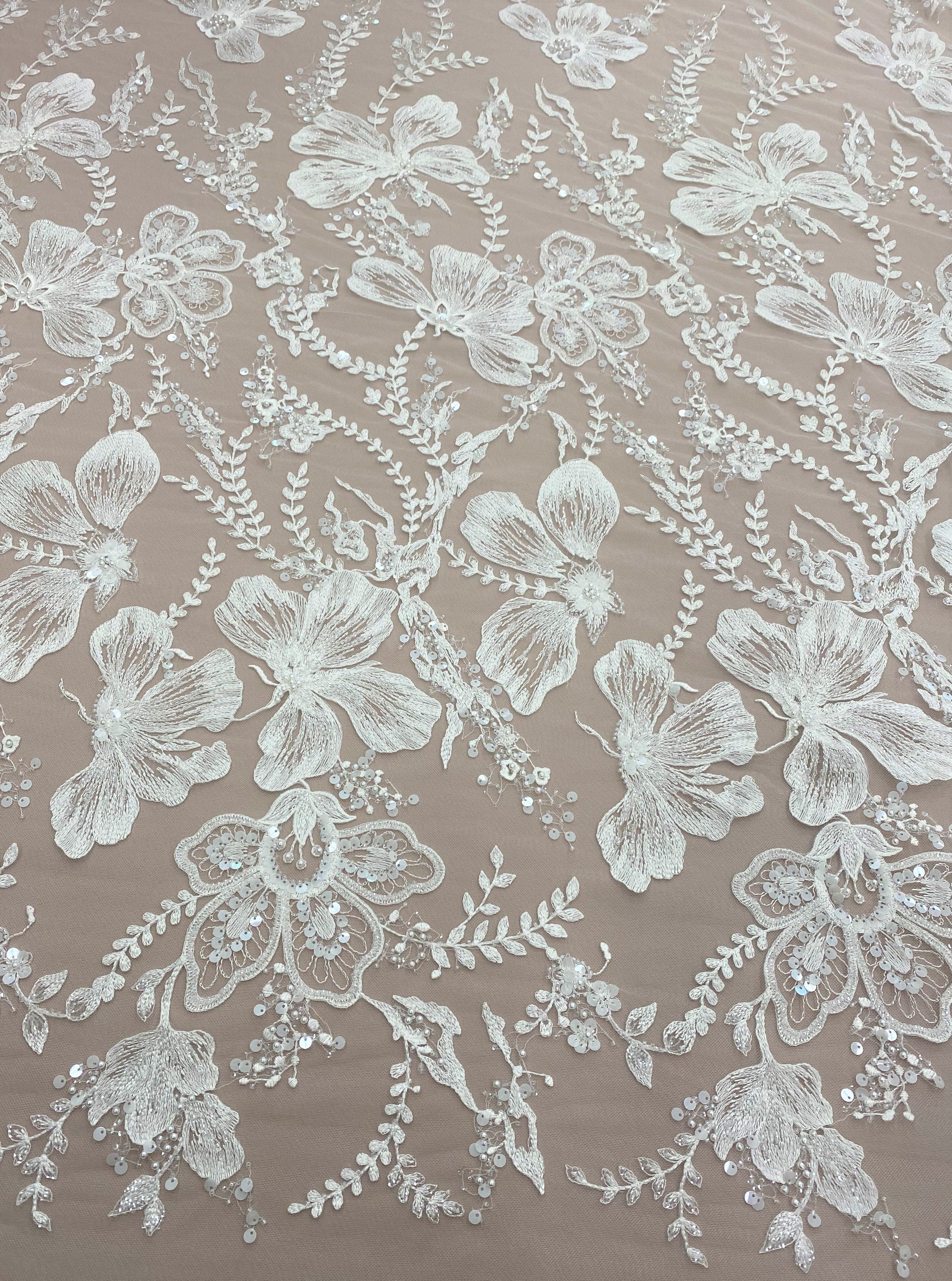 Ivory Embellished Tulle — featuring floral motifs and hand-beading, 60% rayon 40% nylon, 140cm wide