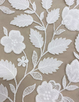 Ivory Embroidered Applique Tulle — featuring scalloped edges, floral motifs and a leaf design, 40% nylon 40% polyester 20% cotton, 130cm wide