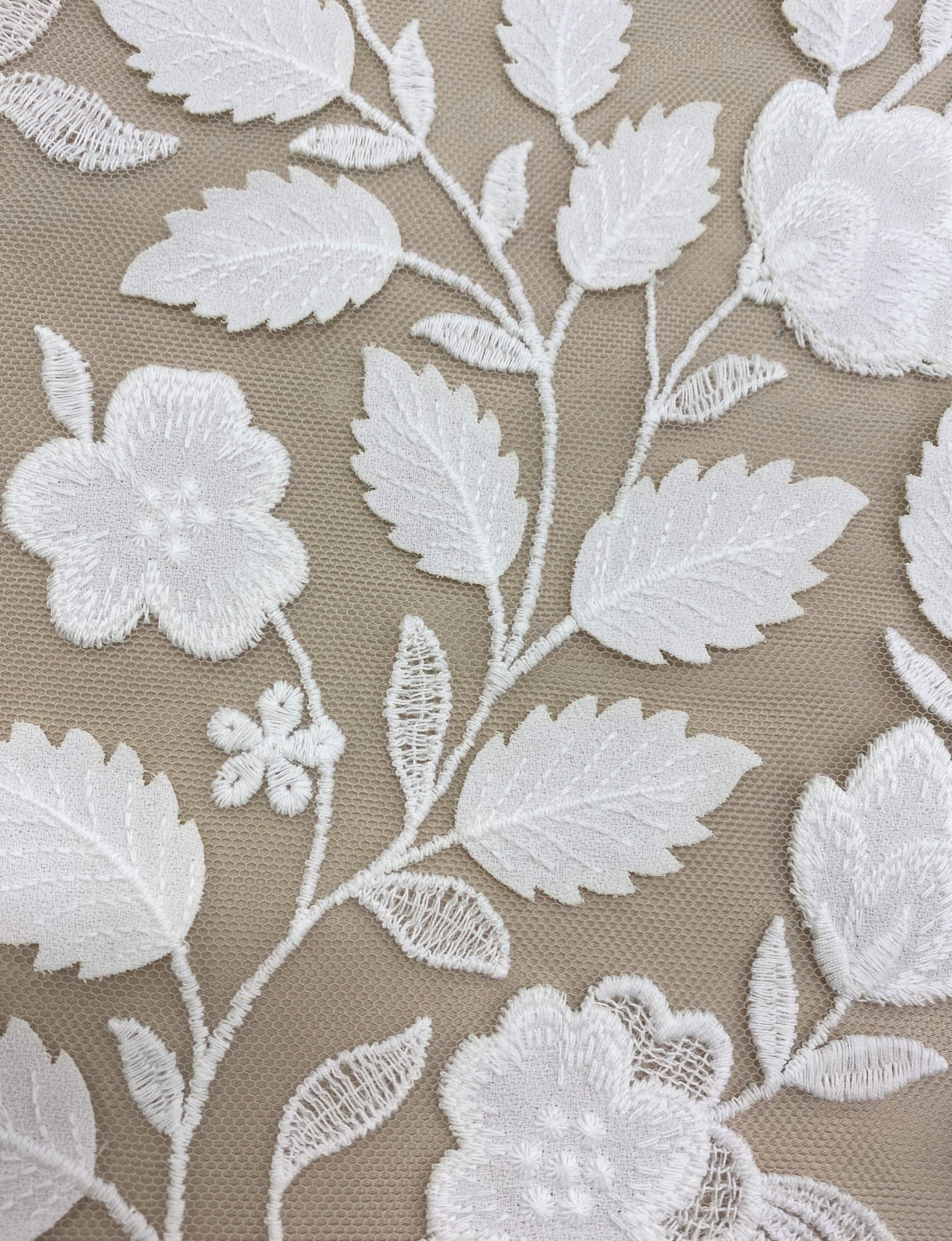 Ivory Embroidered Applique Tulle — featuring scalloped edges, floral motifs and a leaf design, 40% nylon 40% polyester 20% cotton, 130cm wide