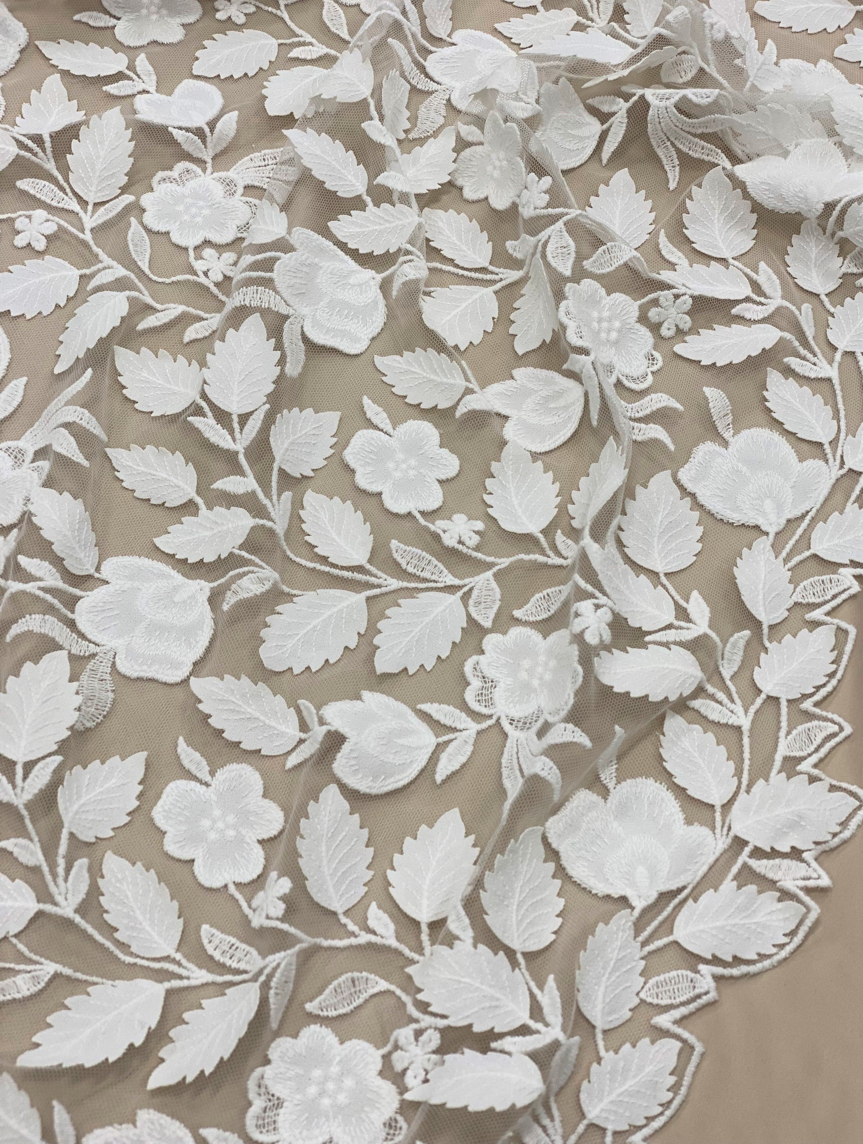 Ivory Embroidered Applique Tulle — featuring scalloped edges, floral motifs and a leaf design, 40% nylon 40% polyester 20% cotton, 130cm wide