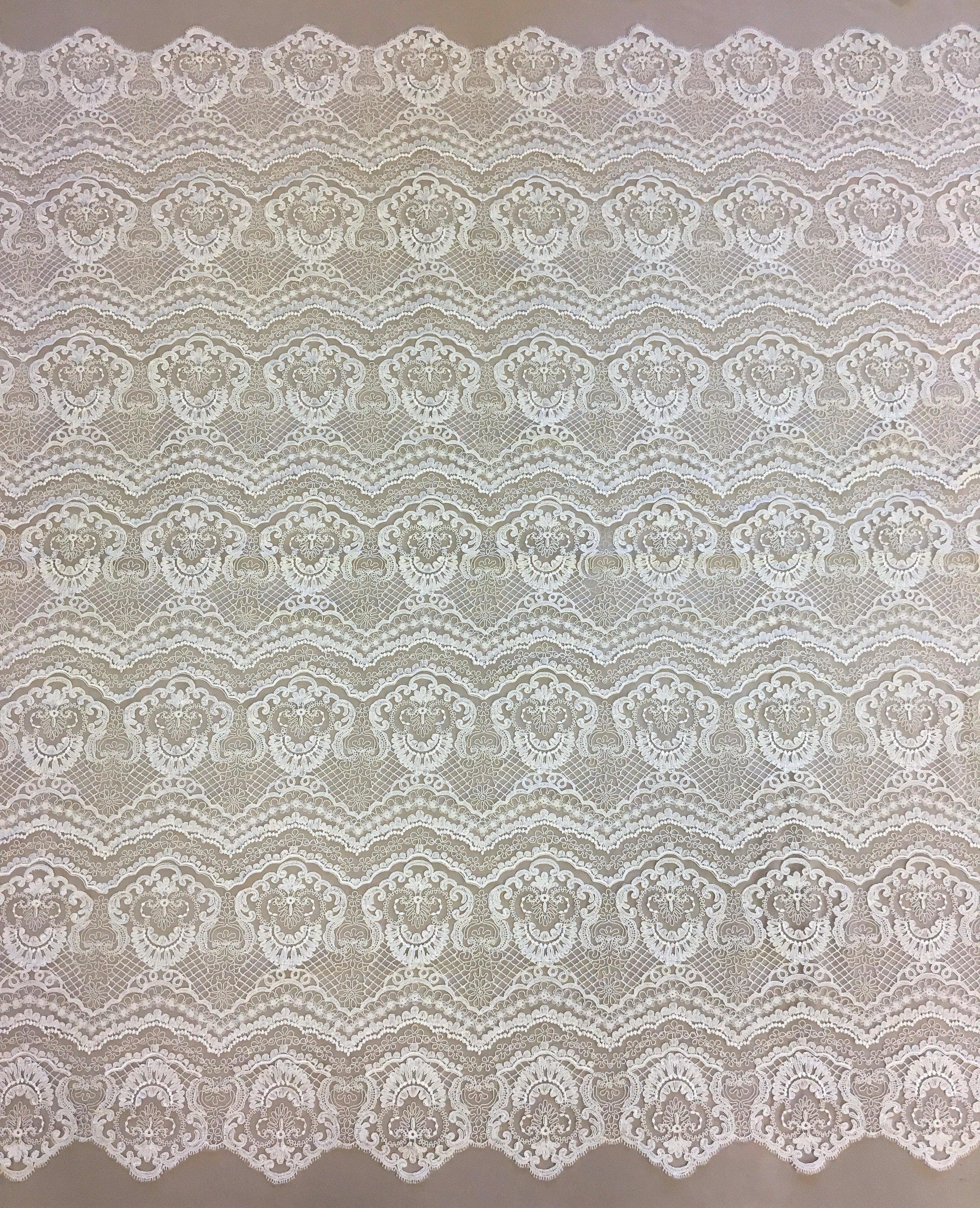 Ivory Scalloped Embroidery — featuring scalloped edges and a corded texture, 50% nylon 50% rayon, 130cm wide