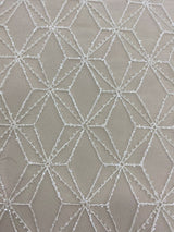 Ivory Beaded Tulle — featuring geometric motifs and hand-beading, 60% nylon 40% polyester, 130cm wide
