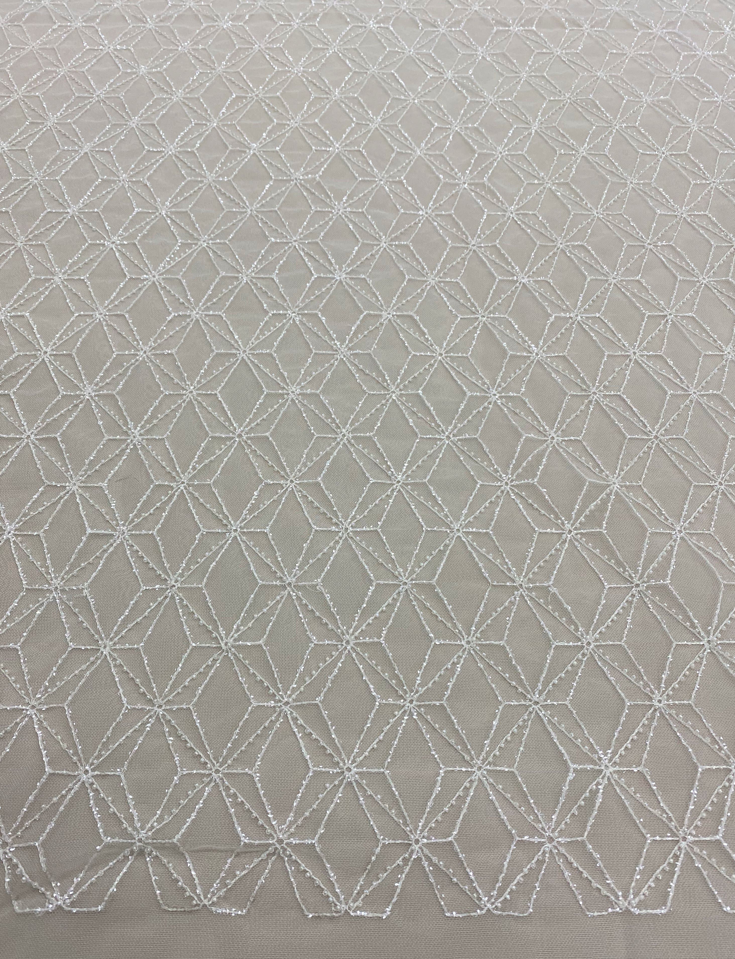 Ivory Beaded Tulle — featuring geometric motifs and hand-beading, 60% nylon 40% polyester, 130cm wide