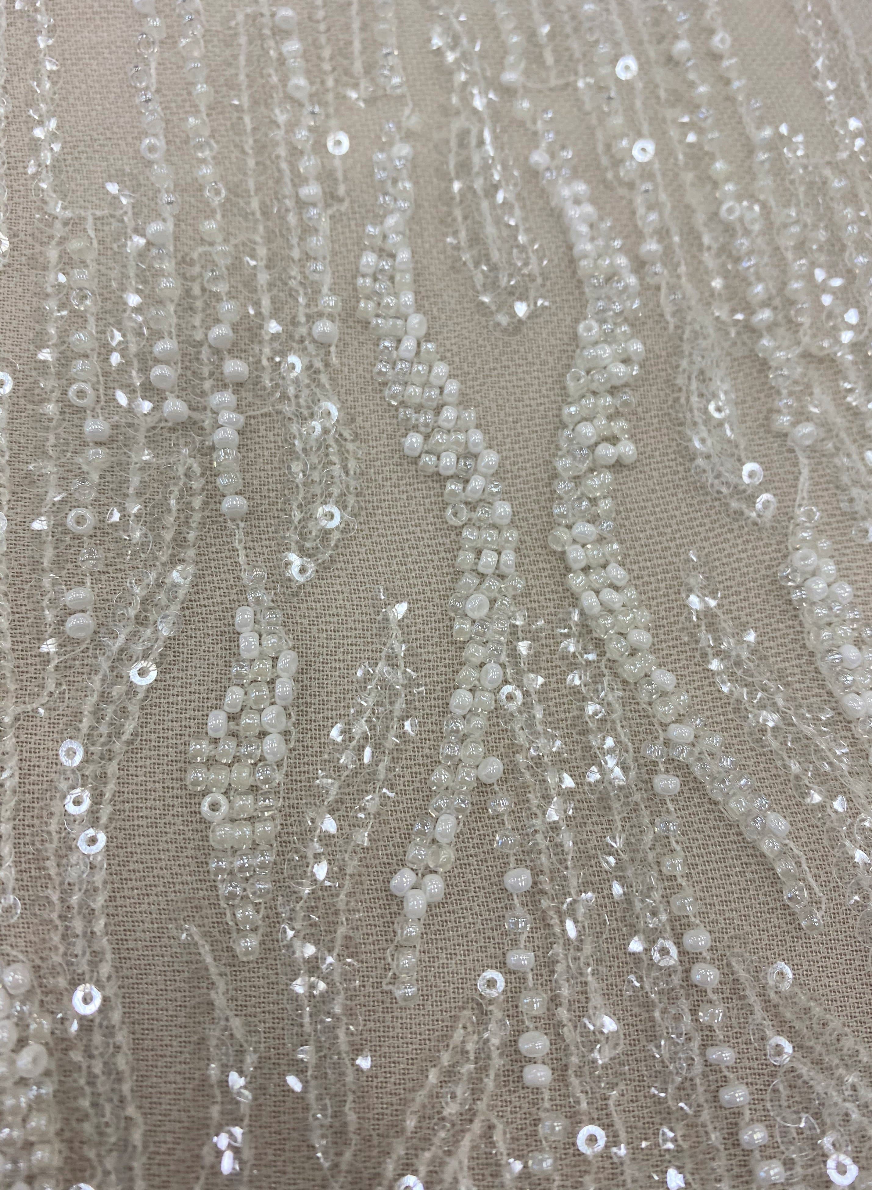 Ivory Embellished Tulle — featuring hand-beading and sequins, 60% nylon 40% polyester, 130cm wide