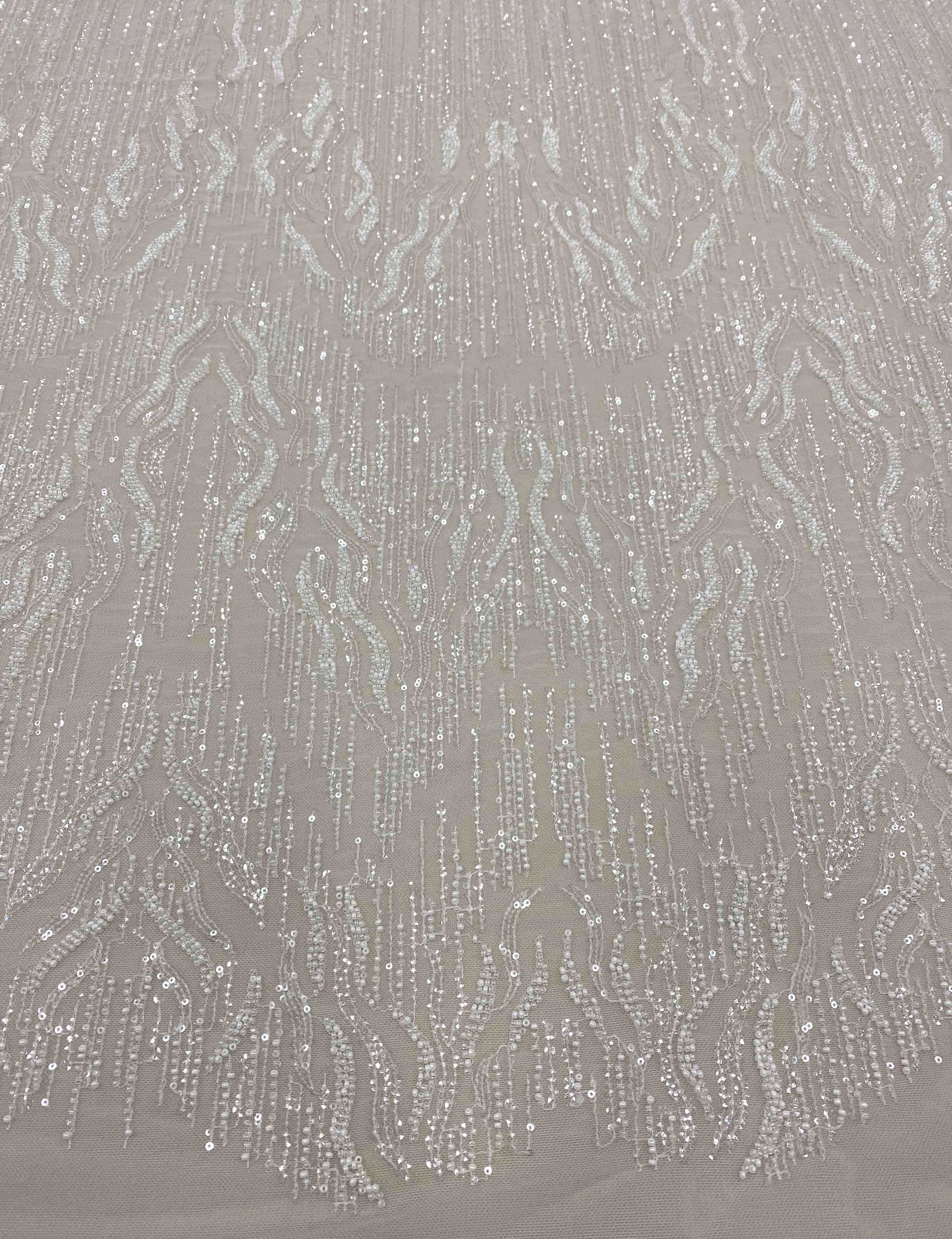 Ivory Embellished Tulle — featuring hand-beading and sequins, 60% nylon 40% polyester, 130cm wide