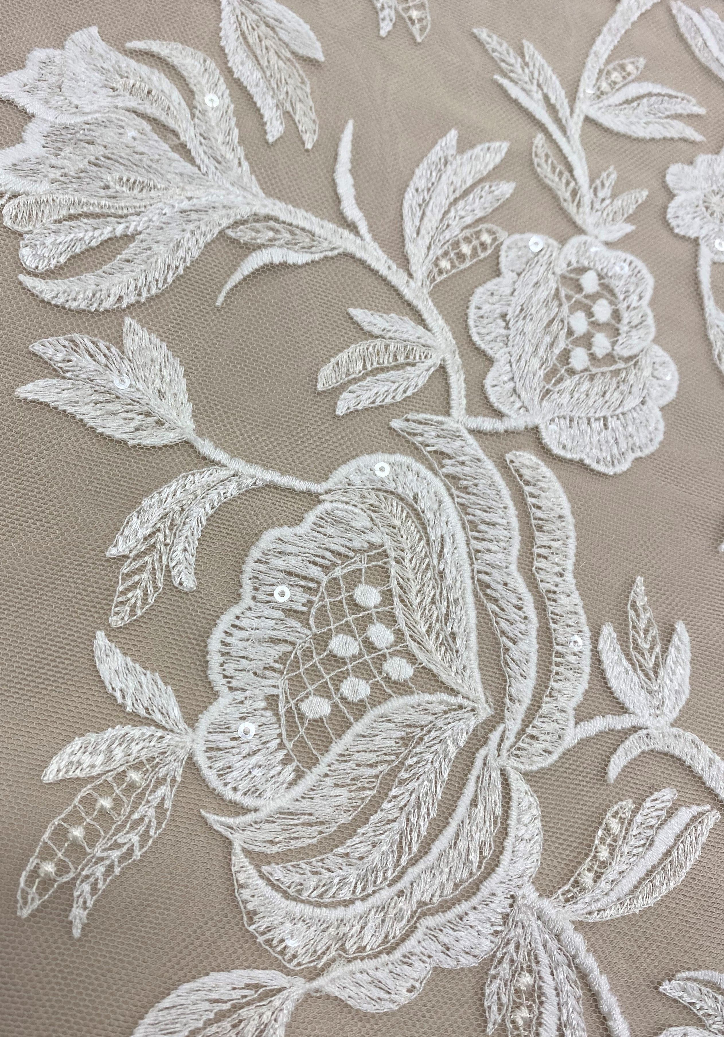 Ivory Embroidered Tulle — featuring scalloped edges, floral motifs and sequins, 50% nylon 50% polyester, 130cm wide