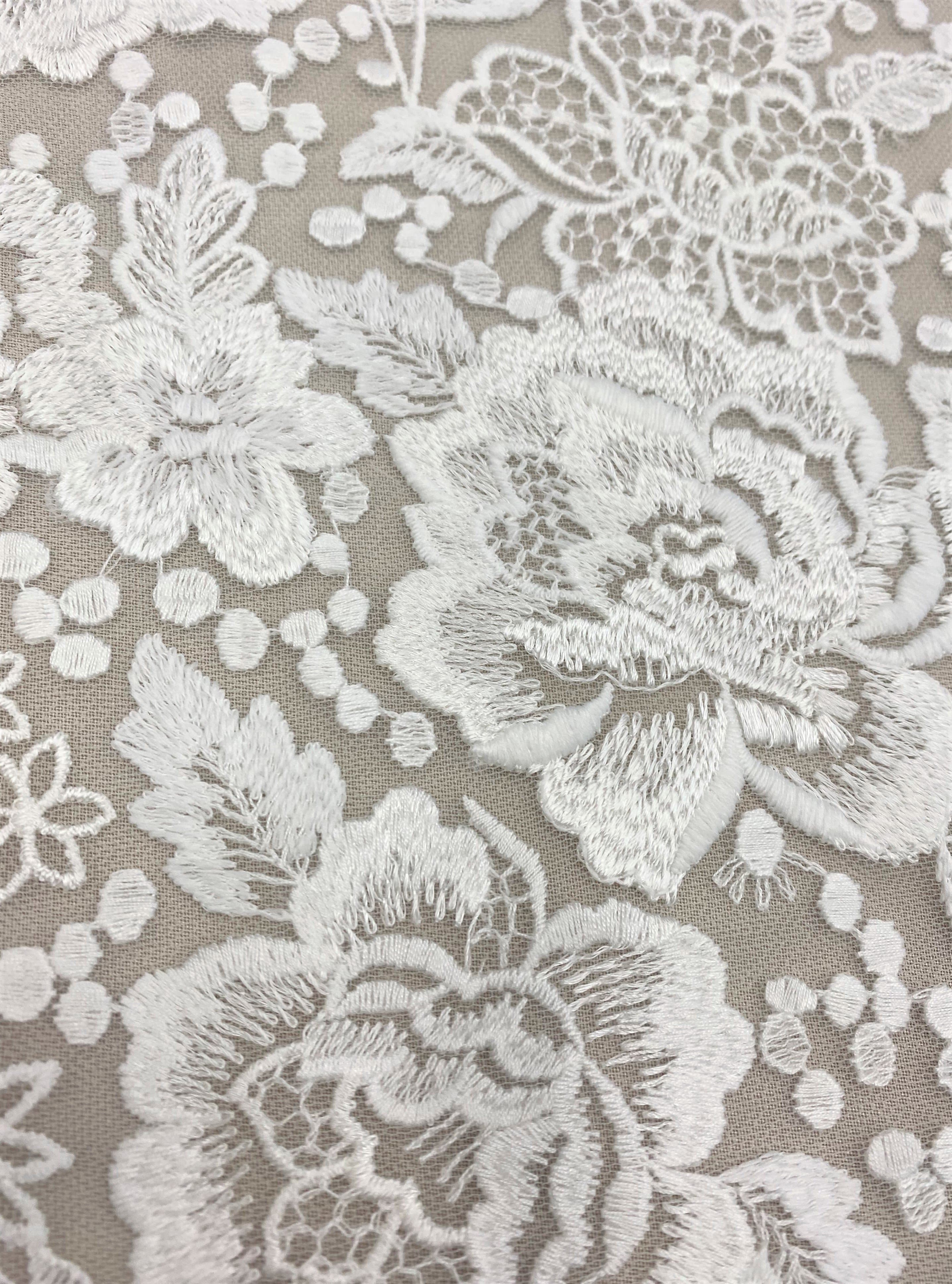 Ivory Embroidered Tulle — featuring floral motifs, 50% nylon 50% rayon, 135cm wide