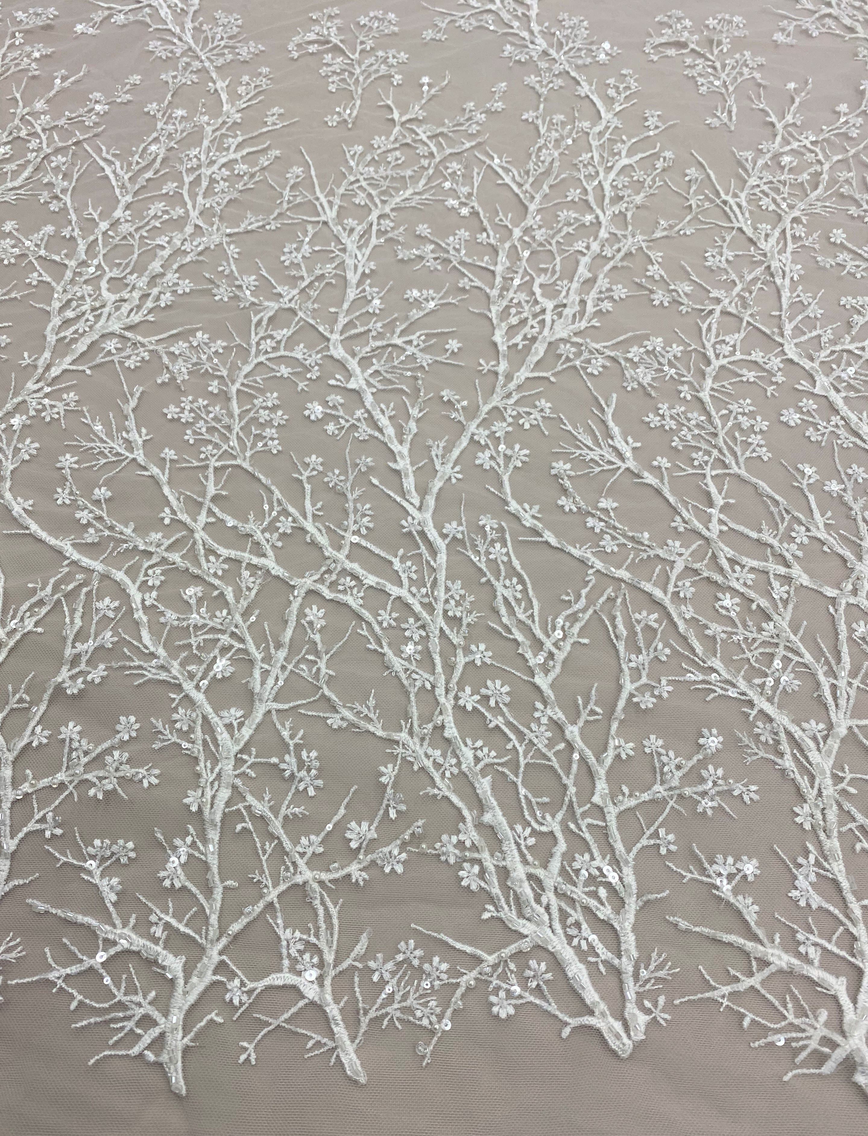 Ivory Floral Embellished Tulle — featuring floral motifs and hand-beading, 50% nylon 50% rayon, 130cm wide