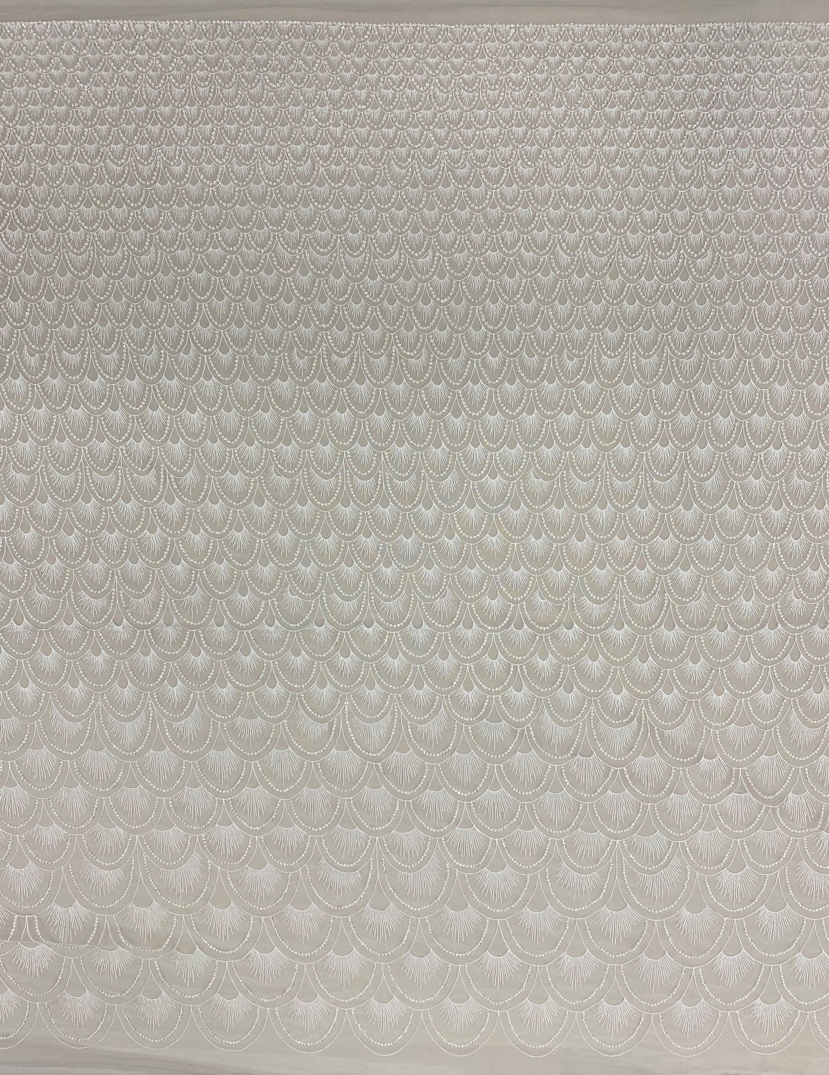 Ivory Embellished Tulle — featuring hand-beading and sequins, 60% nylon 40% polyester, 130cm wide