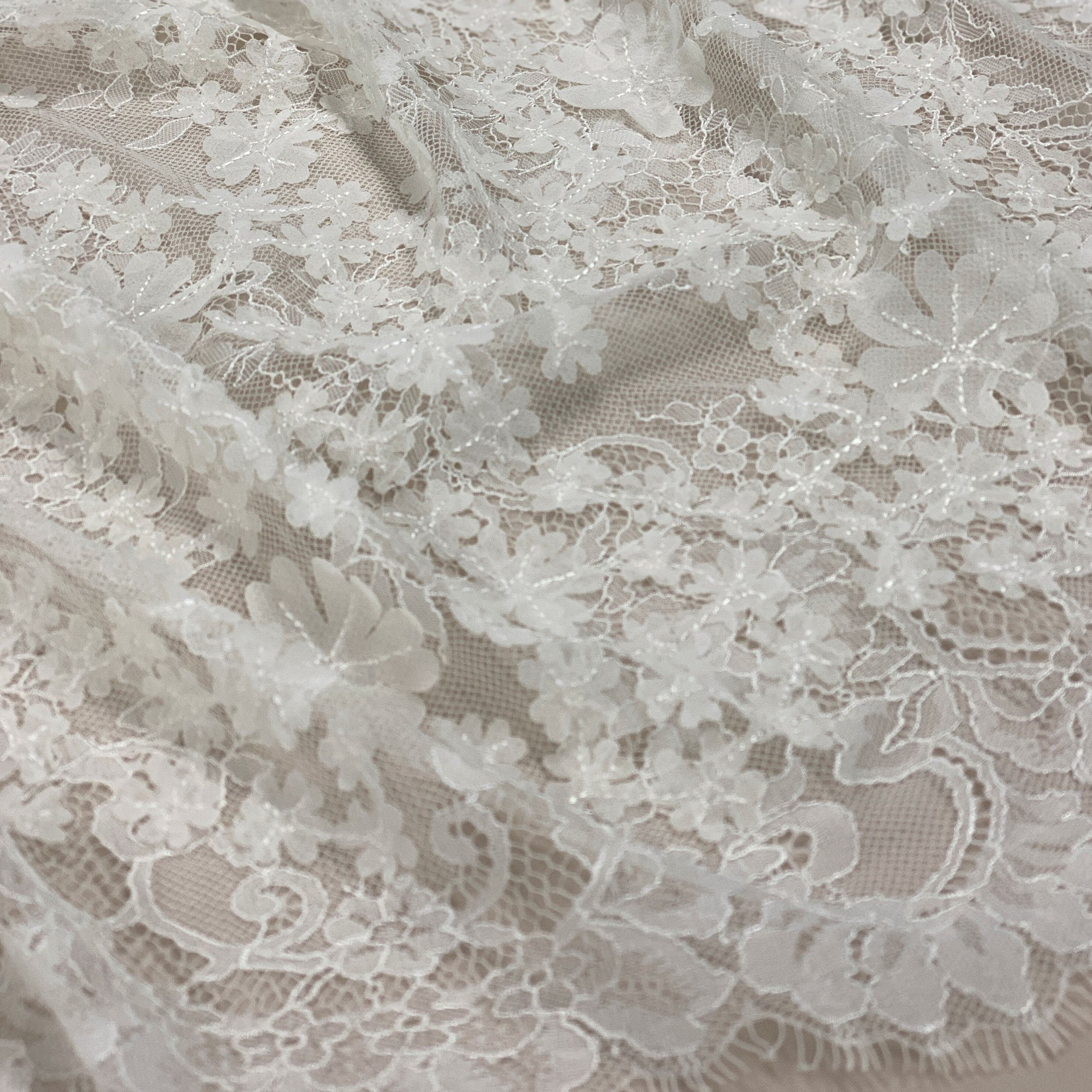 Ivory 3D Floral Lace — featuring scalloped edges, floral motifs and a 3D floral design, in nylon and viscose, 130cm wide