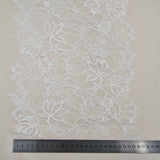 Ivory Fine lace trim — featuring scalloped edges, eyelash detail and floral motifs, in nylon and viscose, 27cm wide