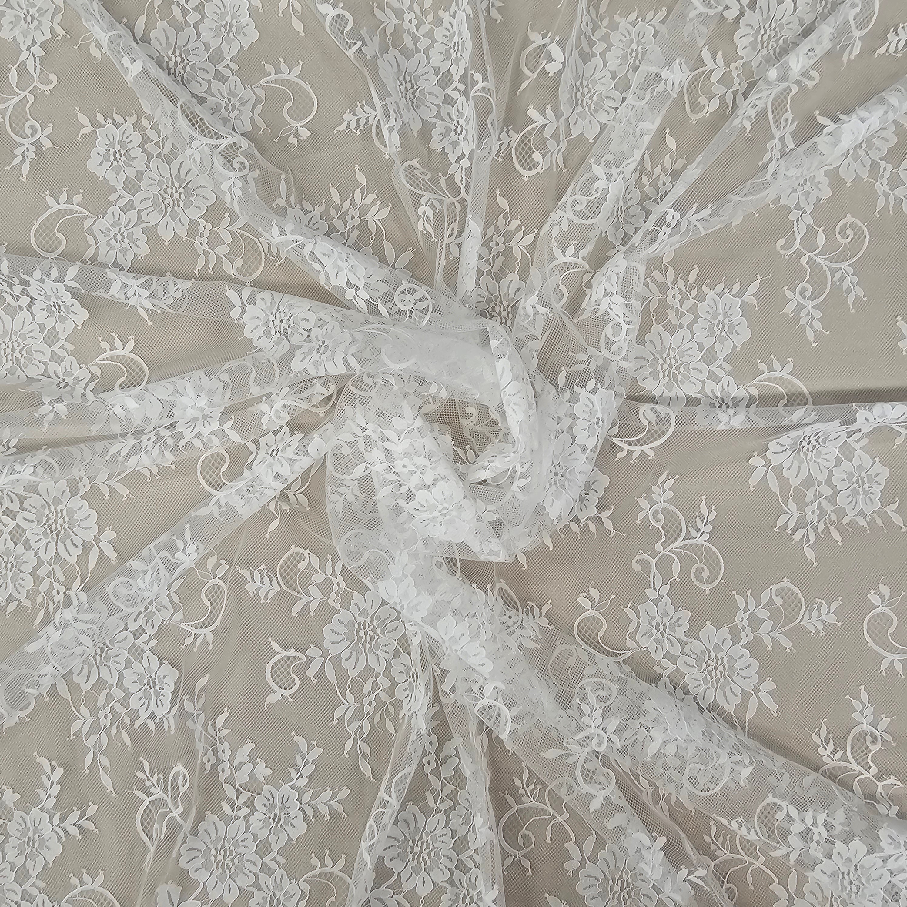 Ivory Fine Floral Lace — featuring scalloped edges and floral motifs, 130cm wide