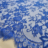 Marine Fine Floral Lace — featuring scalloped edges and floral motifs, 130cm wide