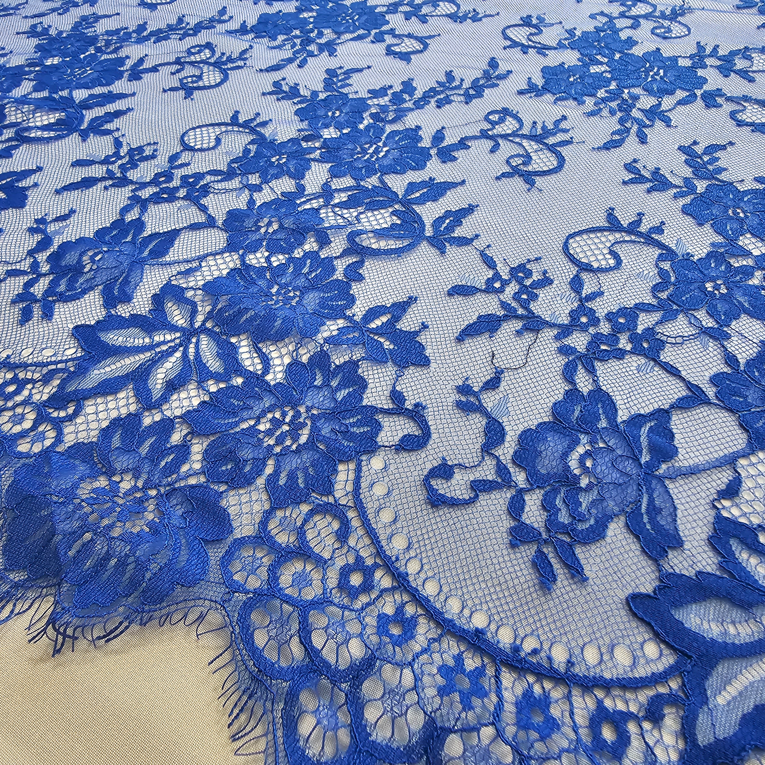 Marine Fine Floral Lace — featuring scalloped edges and floral motifs, 130cm wide