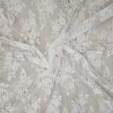 Ivory Fine Floral Lace — featuring scalloped edges, eyelash detail and floral motifs, in nylon and cotton, 150cm wide