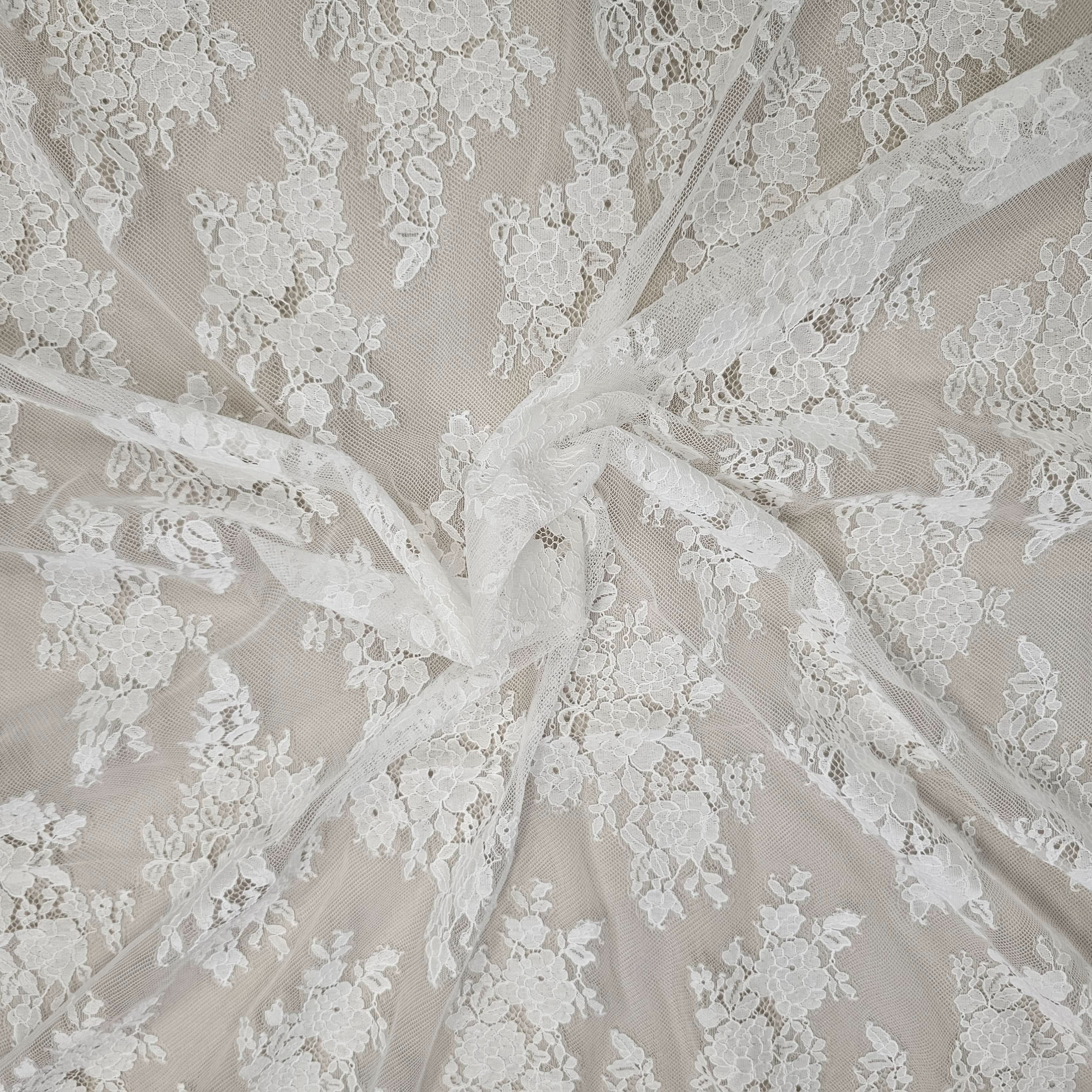 Ivory Fine Floral Lace — featuring scalloped edges, eyelash detail and floral motifs, in nylon and cotton, 150cm wide